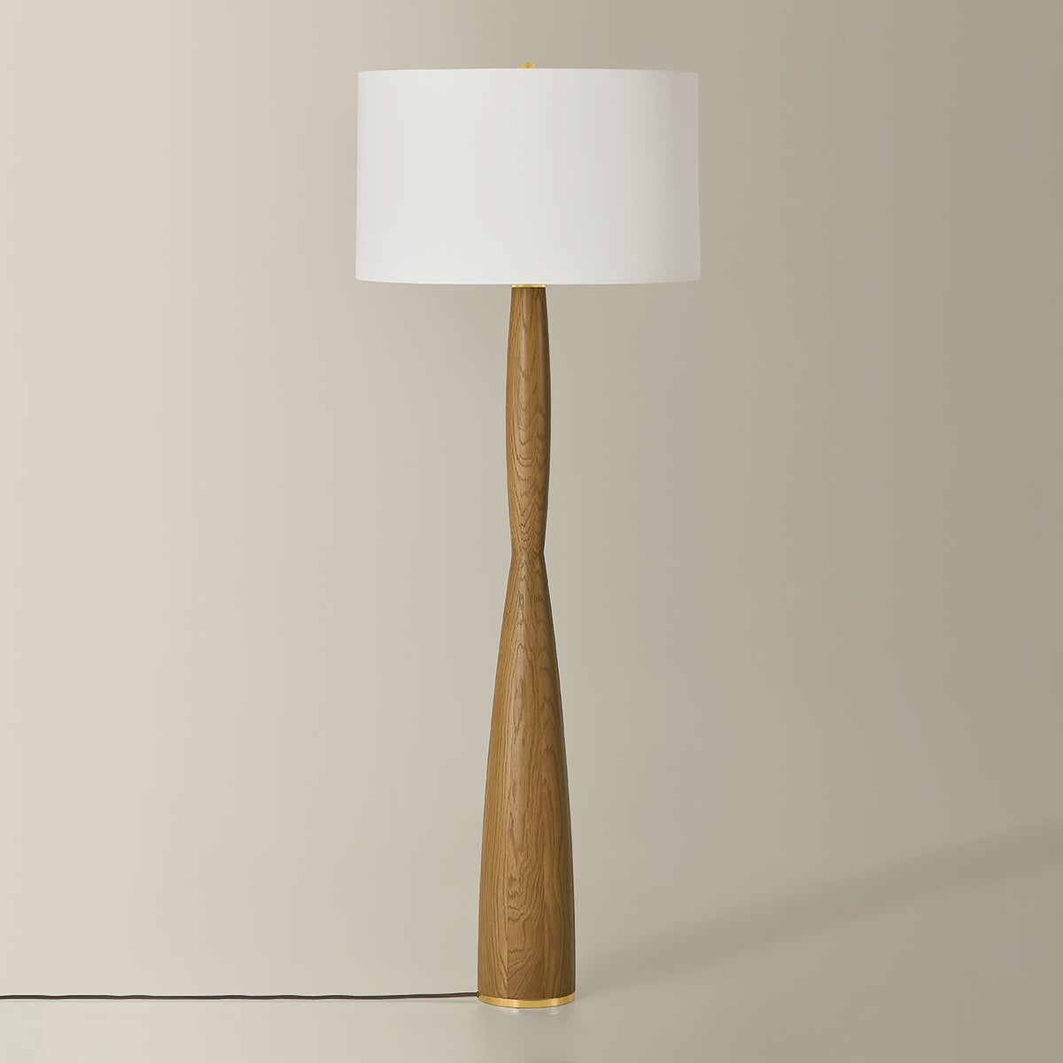 Somers Chase Floor Lamp in aged brass shown from a second angle to highlight the stem, base, and shade proportions.