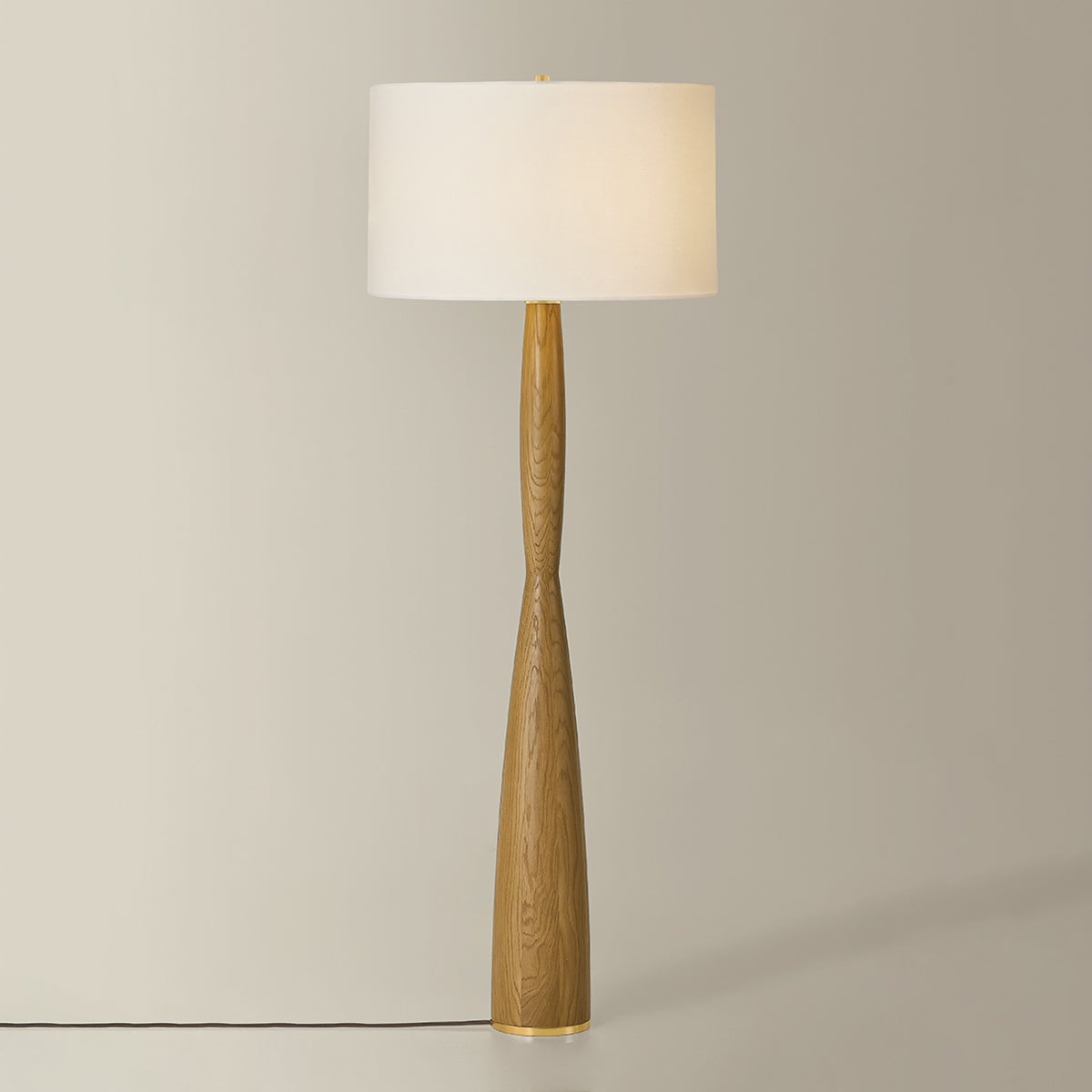 Somers Chase Floor Lamp in aged brass shown from the front to reveal the stem, base, and shade proportions.