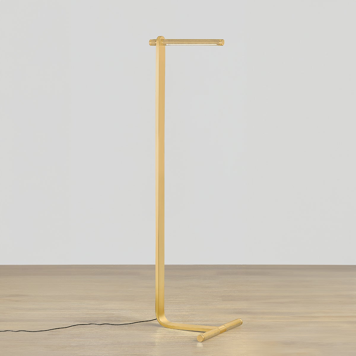 Deptford Floor Lamp in aged brass shown from a second angle to highlight the stem, base, and shade proportions.