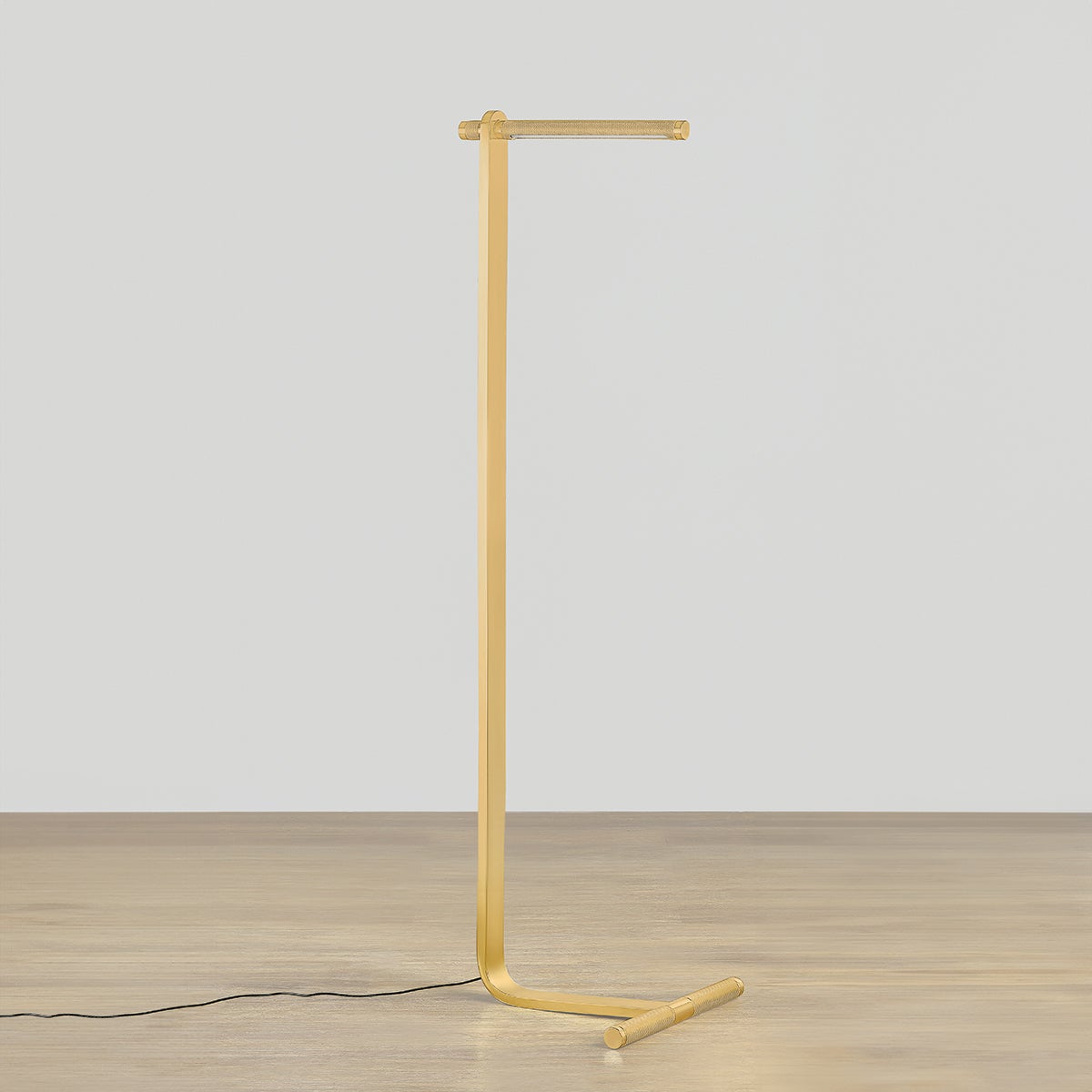 Deptford Floor Lamp in aged brass shown from the front to reveal the stem, base, and shade proportions.