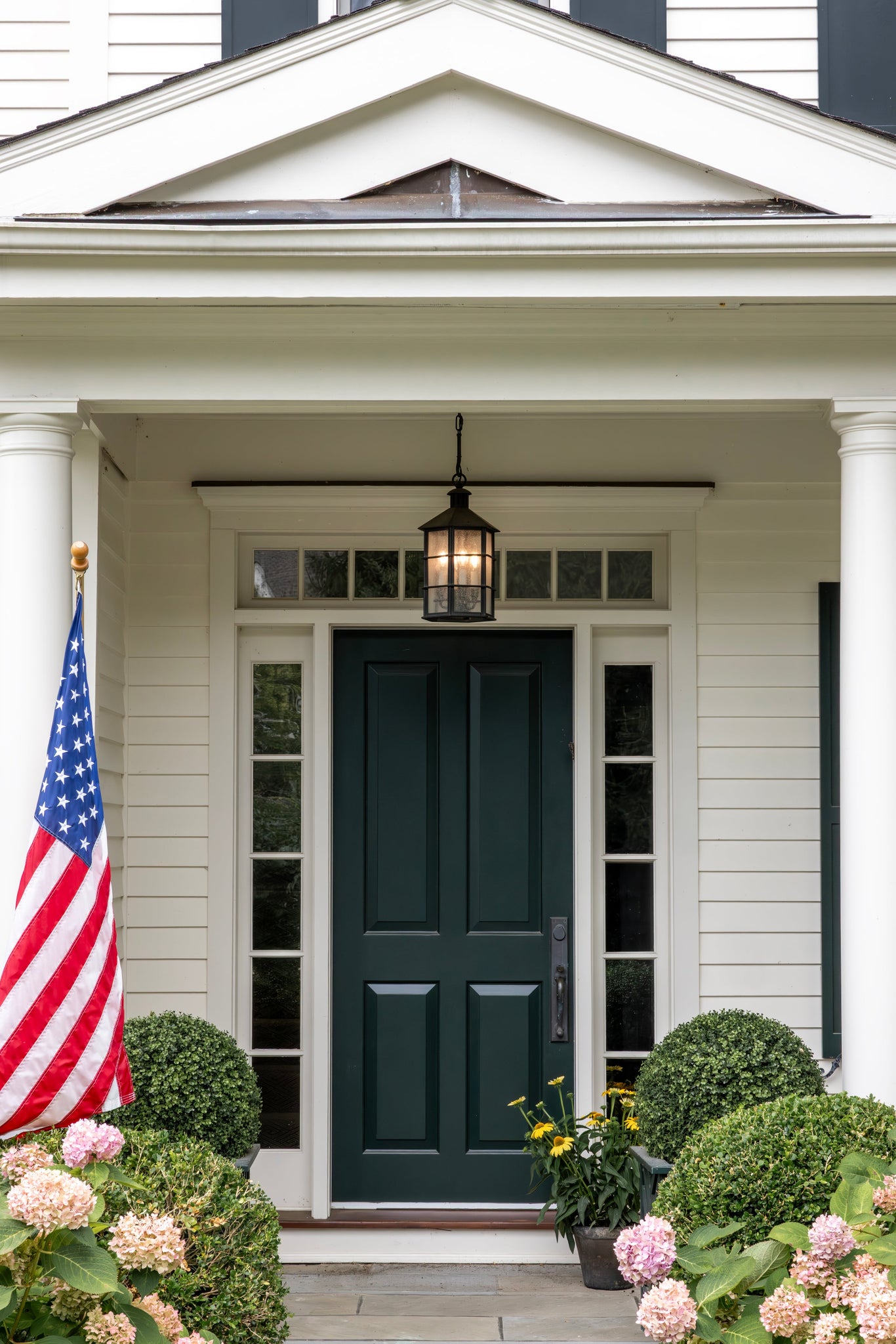 Lake County Exterior Lantern styled in a foyer for warm, layered light at Laurie Yapp Home.