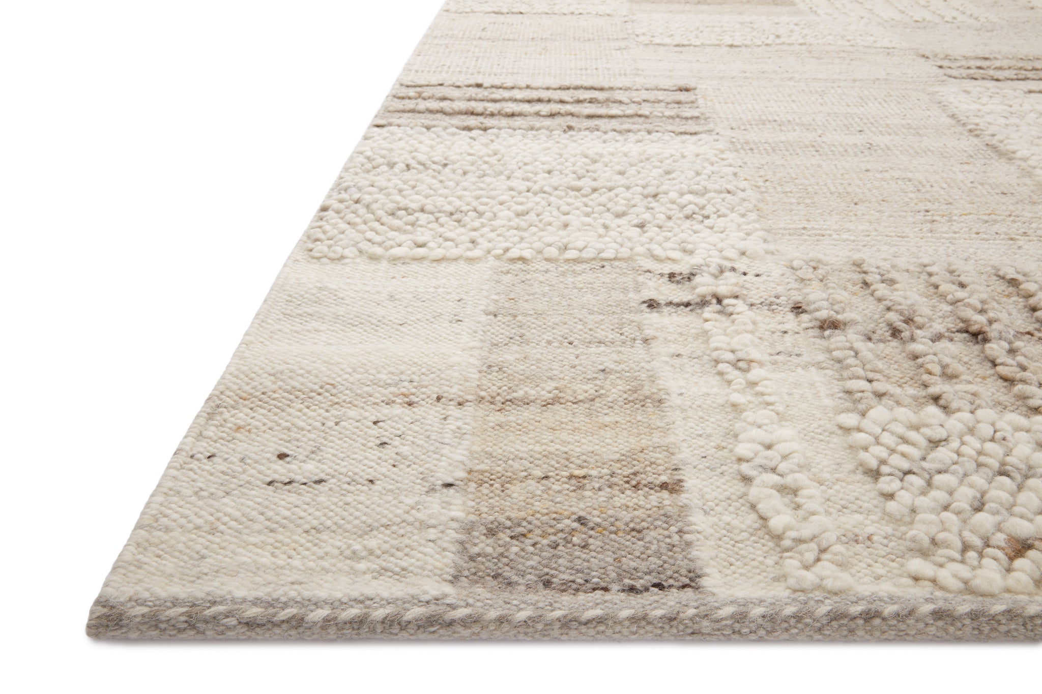 Side view of the Manfred Natural / Stone rug.