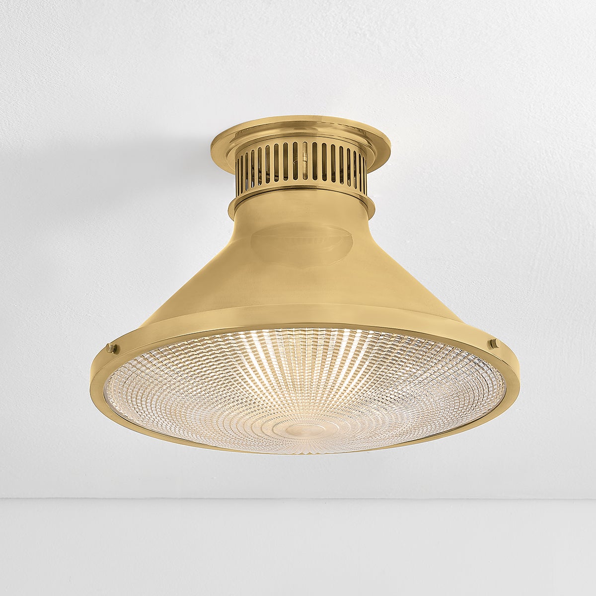 Close-up of the Highclere Flush Mount 17.75" in aged brass showing the shade profile and mounting canopy.