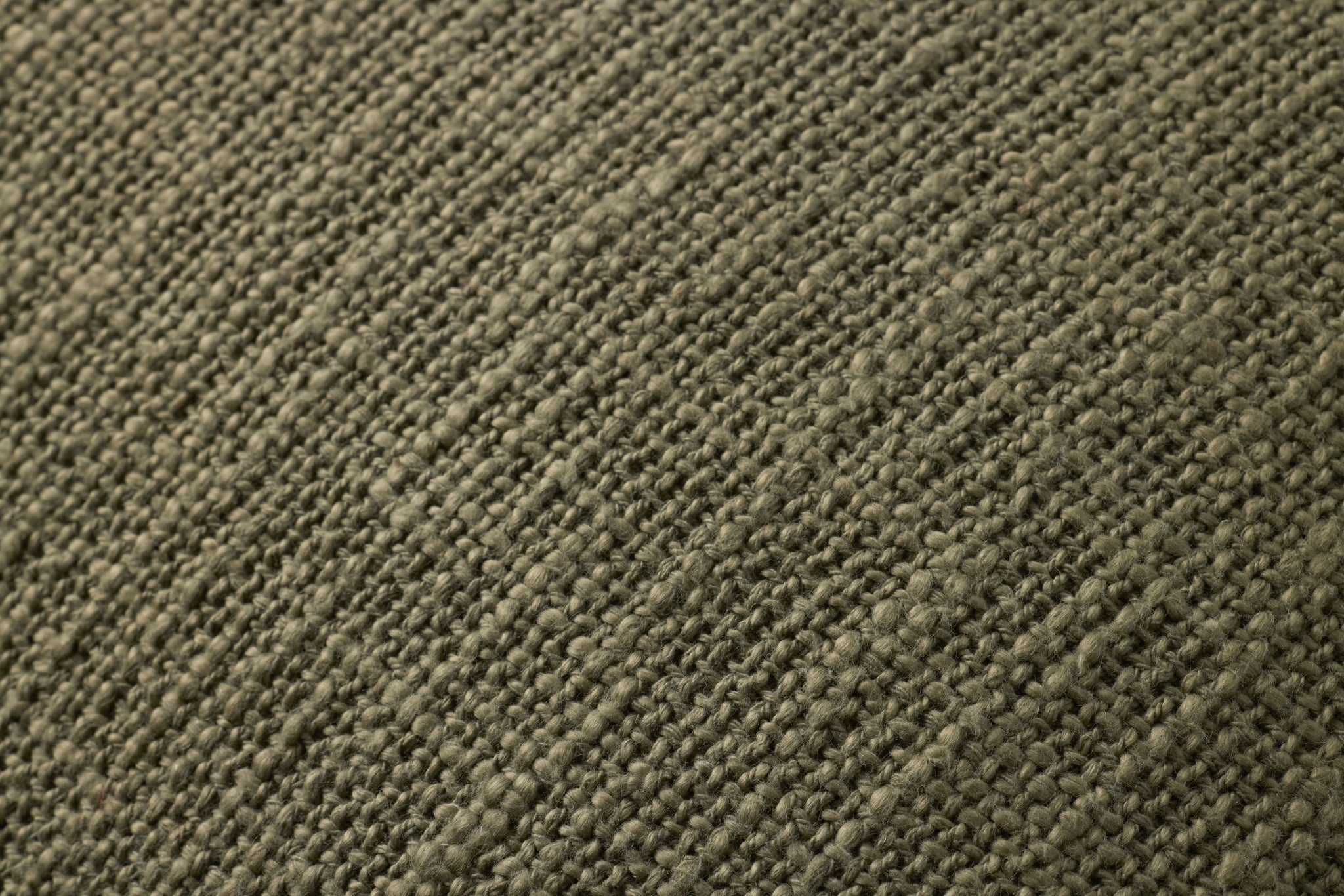 Olive Pillow shown from a different angle to reveal its pattern.