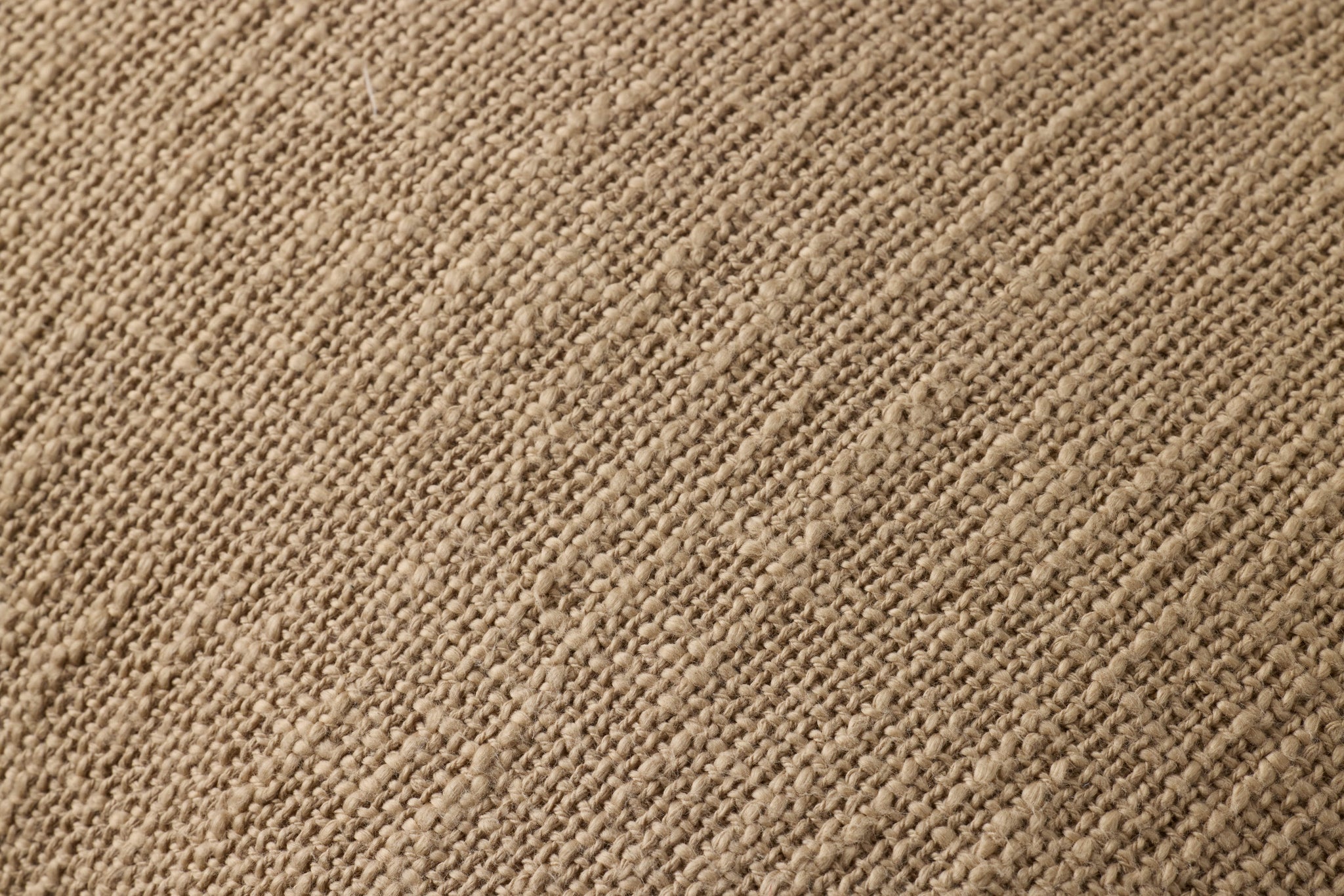 Tan Pillow (Pattern 1) shown from a different angle to reveal its pattern.