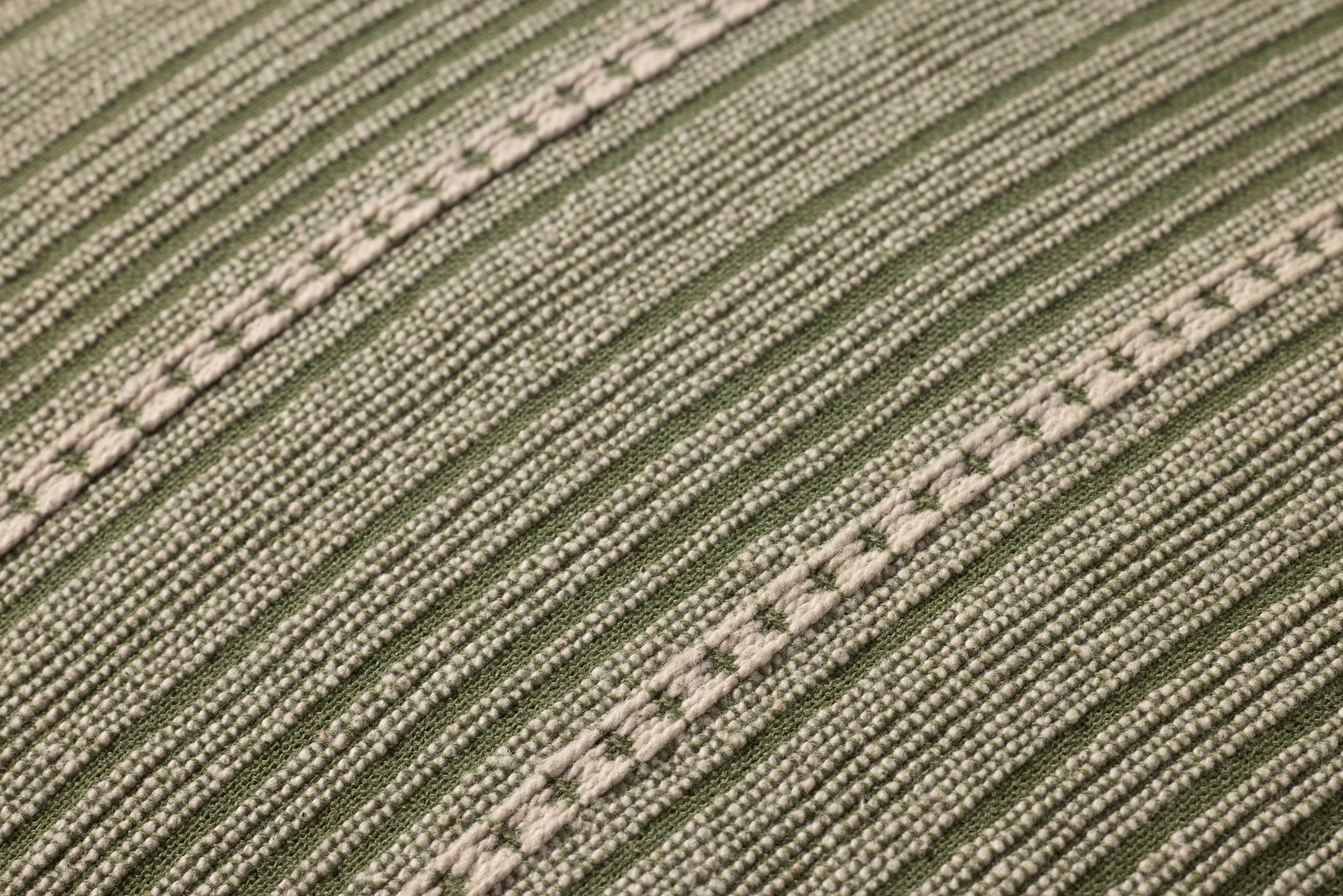 Howie Green / Natural Pillow shown from a different angle to reveal its pattern.