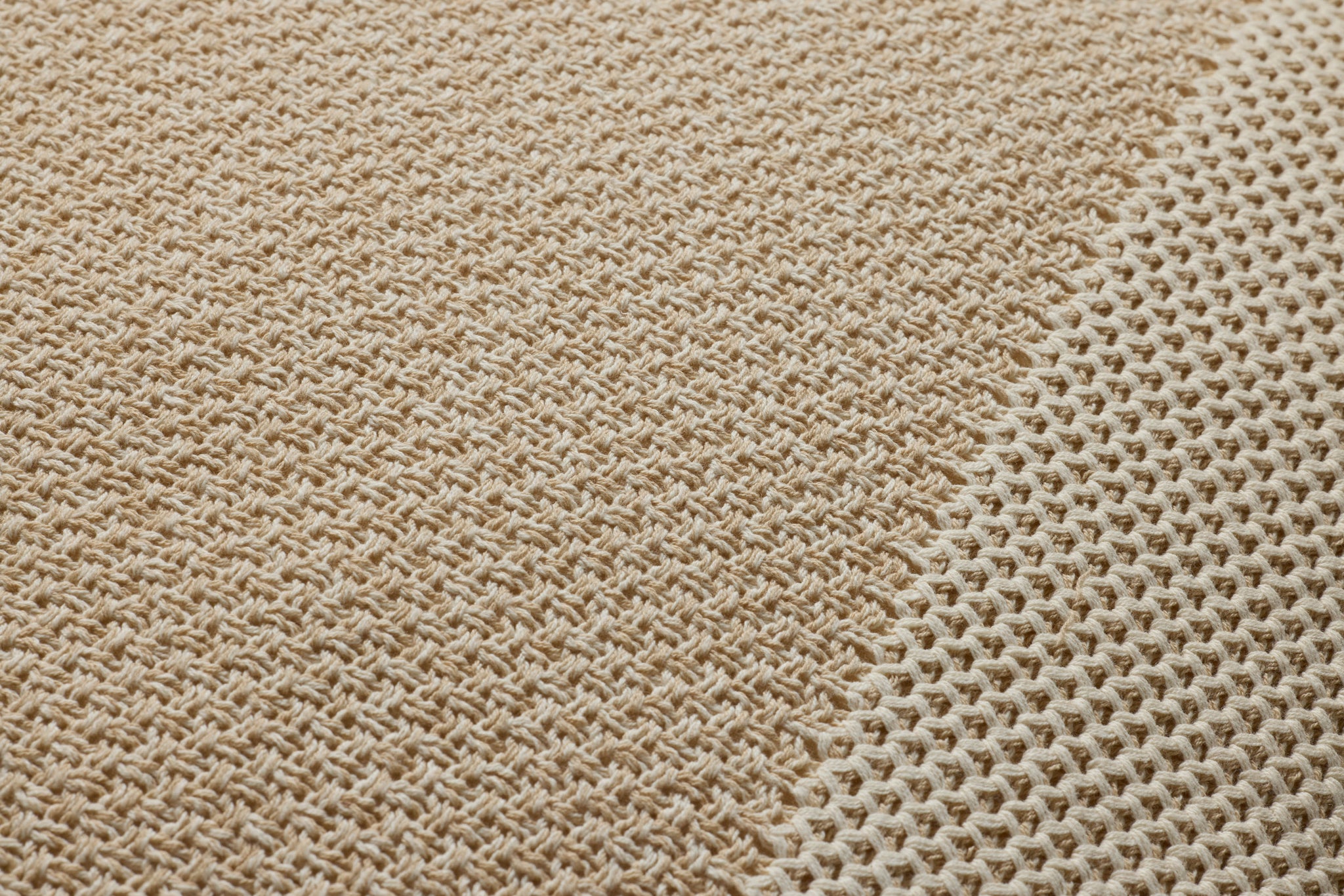 Ivory / Beige Pillow shown from a different angle to reveal its pattern.