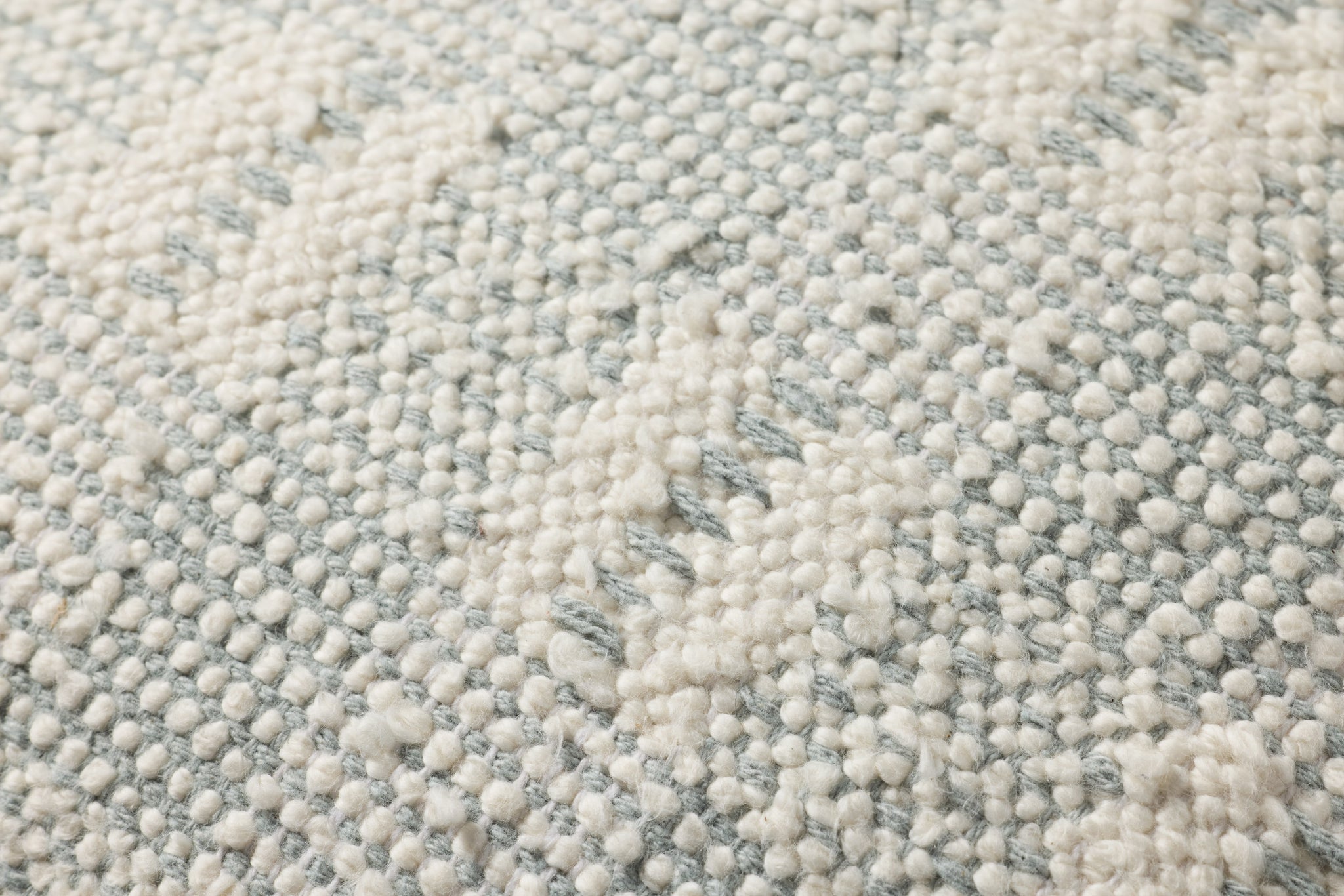 Ivory / Blue Pillow shown from a different angle to reveal its pattern.