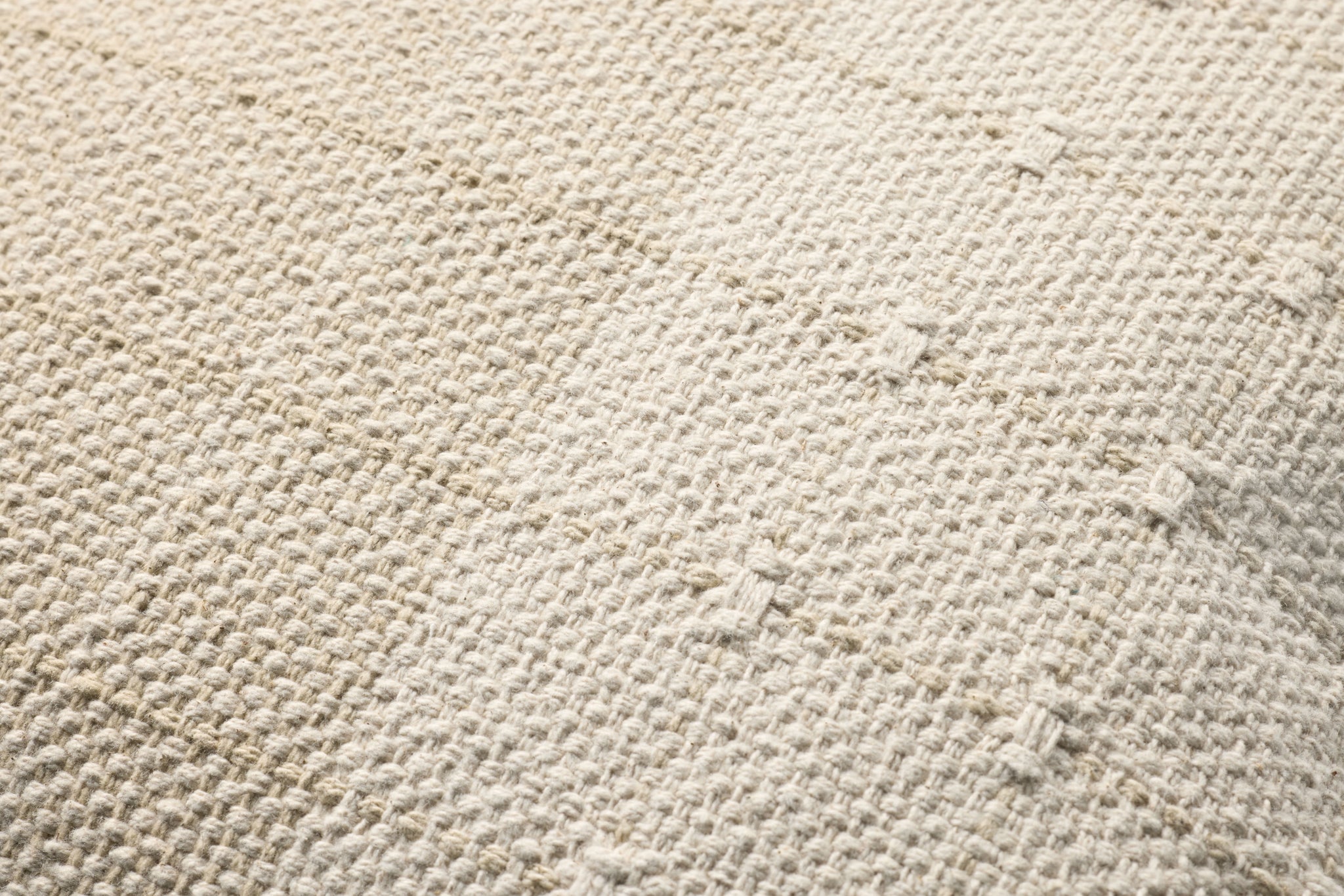 Beige / Natural Pillow shown from a different angle to reveal its pattern.