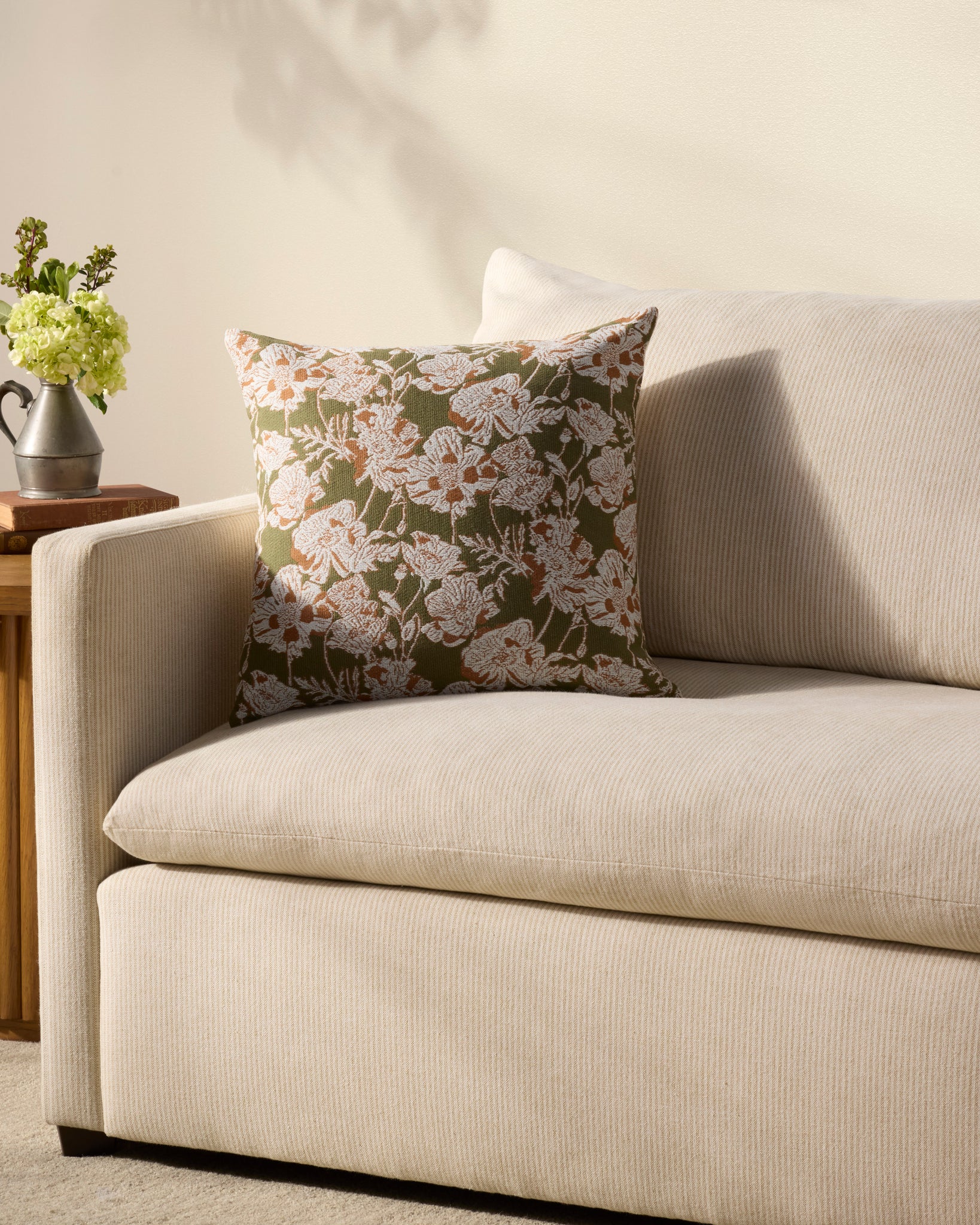 Matilda Olive / Orange Pillow shown from a different angle to reveal its pattern.