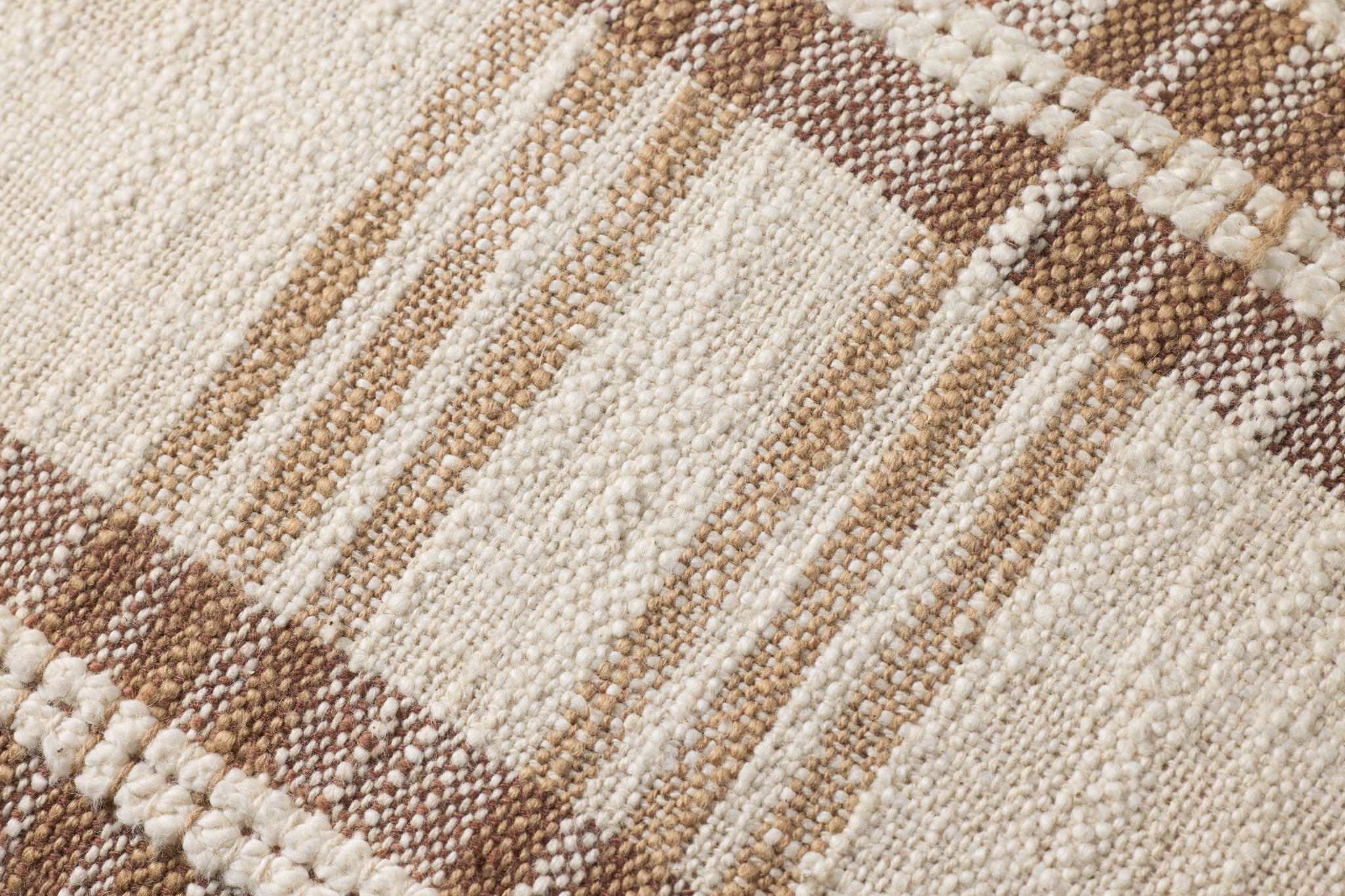 Tan / Multi Pillow shown from a different angle to reveal its pattern.