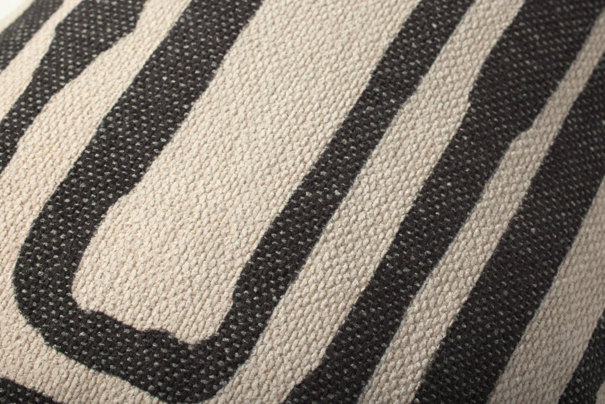 Natural / Black Pillow shown from a different angle to reveal its pattern.