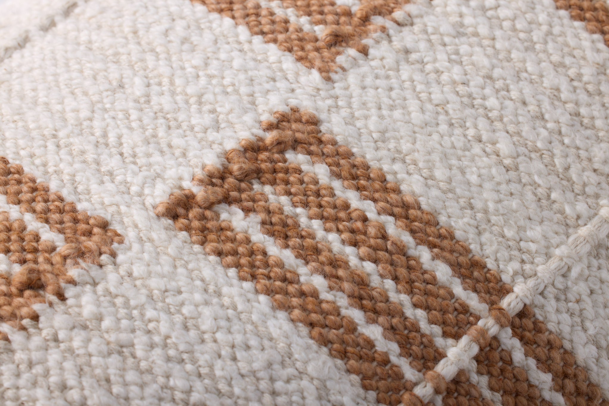 Rust / Ivory Pillow (Pattern 2) shown from a different angle to reveal its pattern.