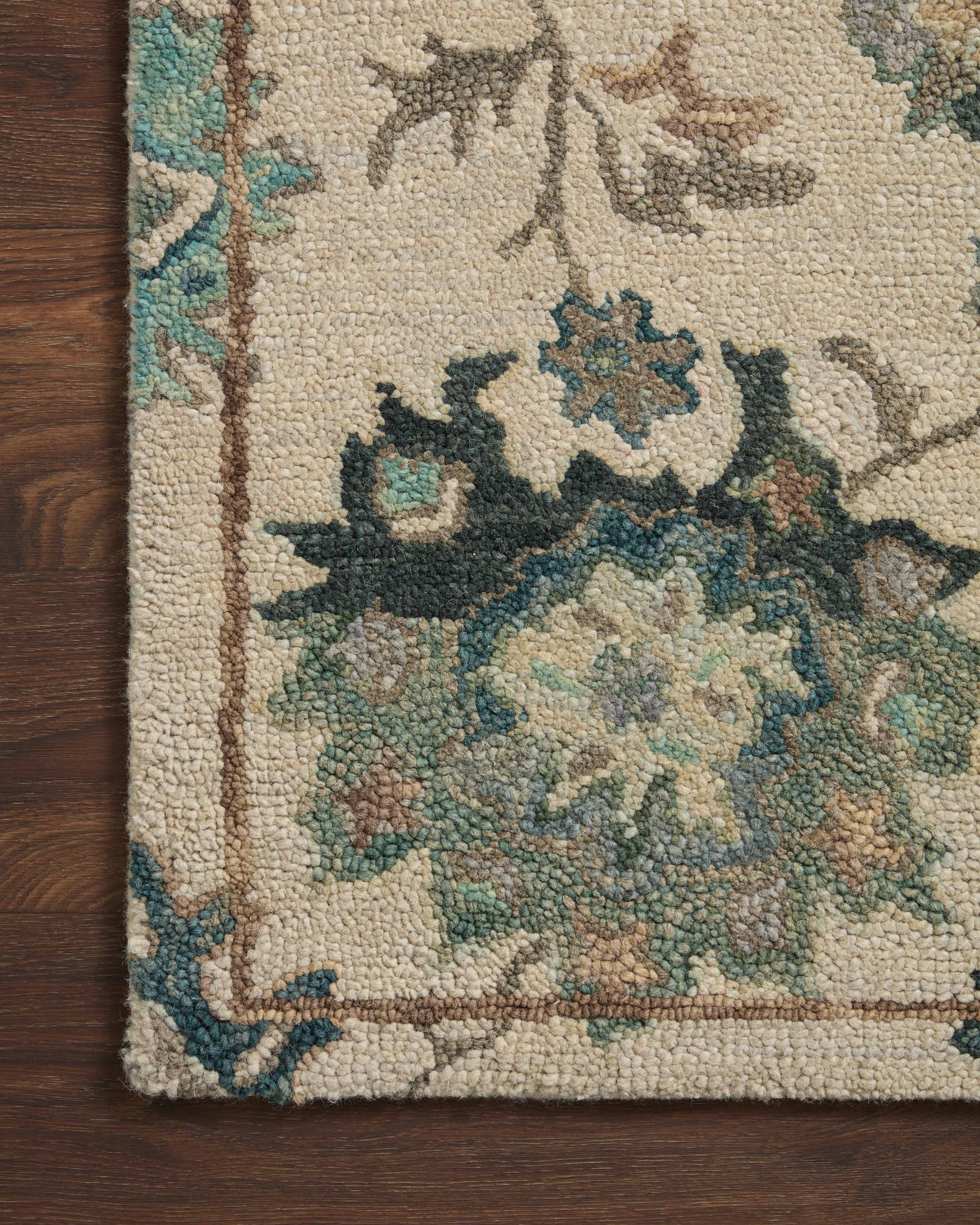 Side view of the Padma Ivory / Blue rug.