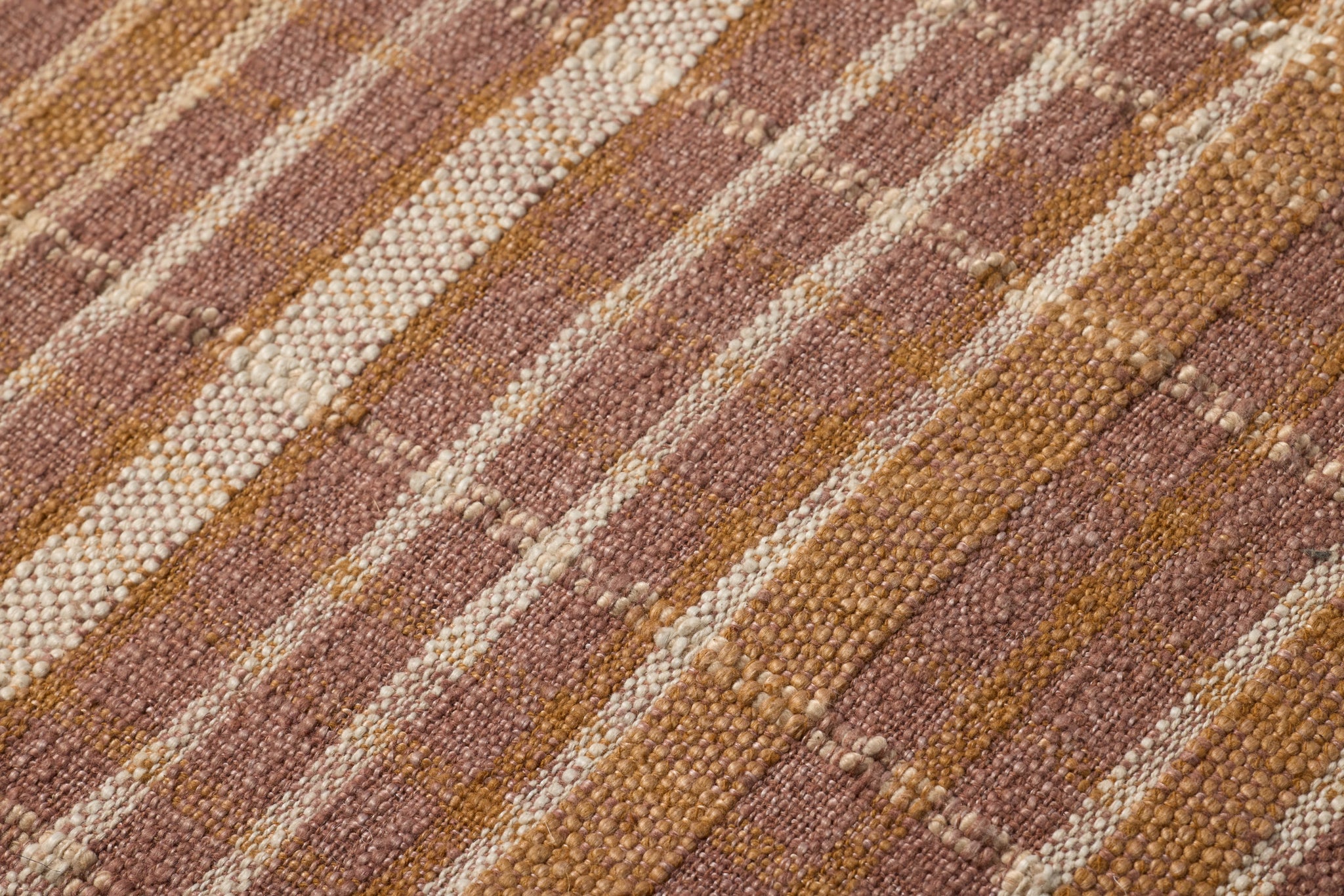 Wallace Clay Clay Pouf shown from a different angle to reveal its pattern.