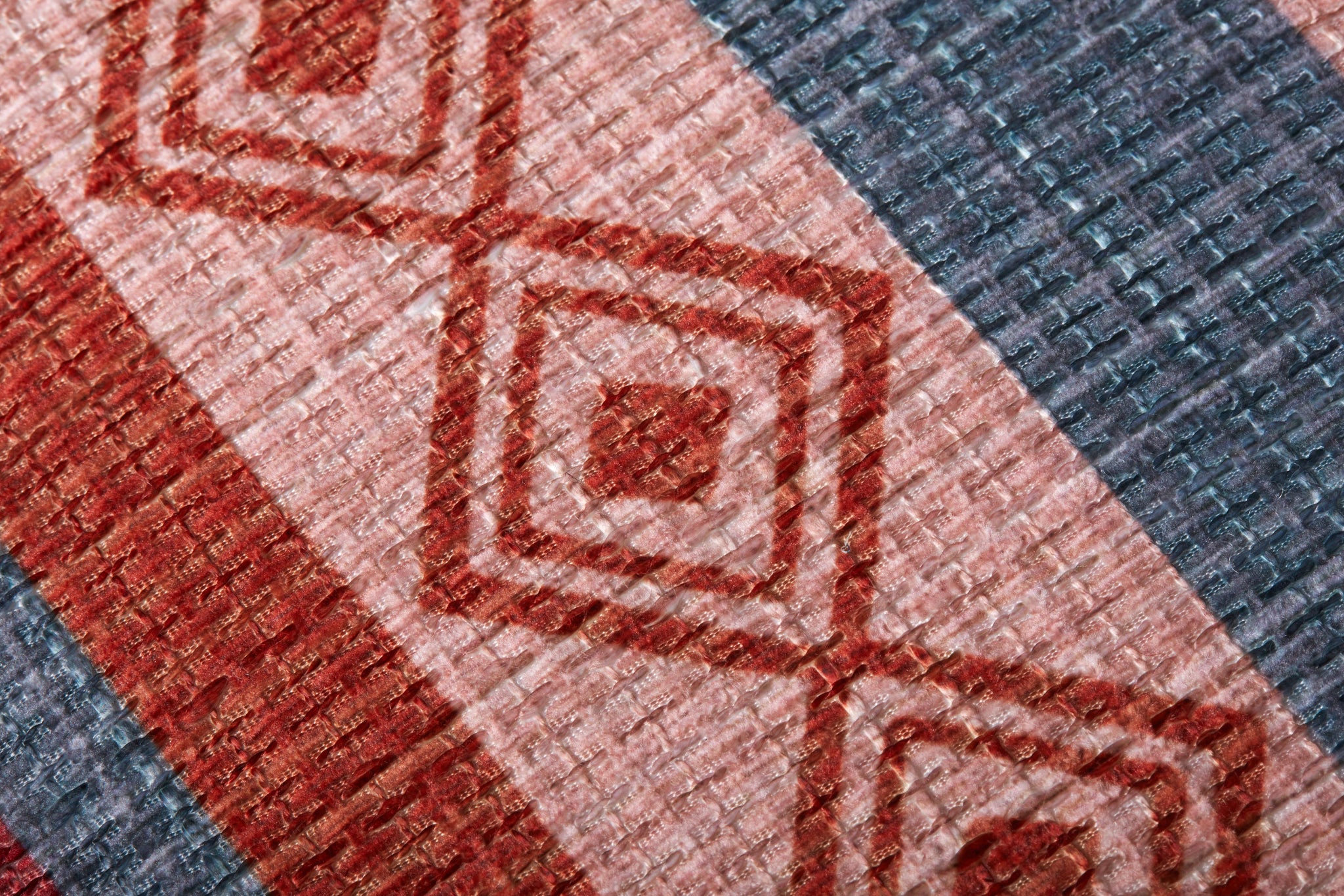 Poufs Red / Pink shown from a different angle to reveal its pattern.