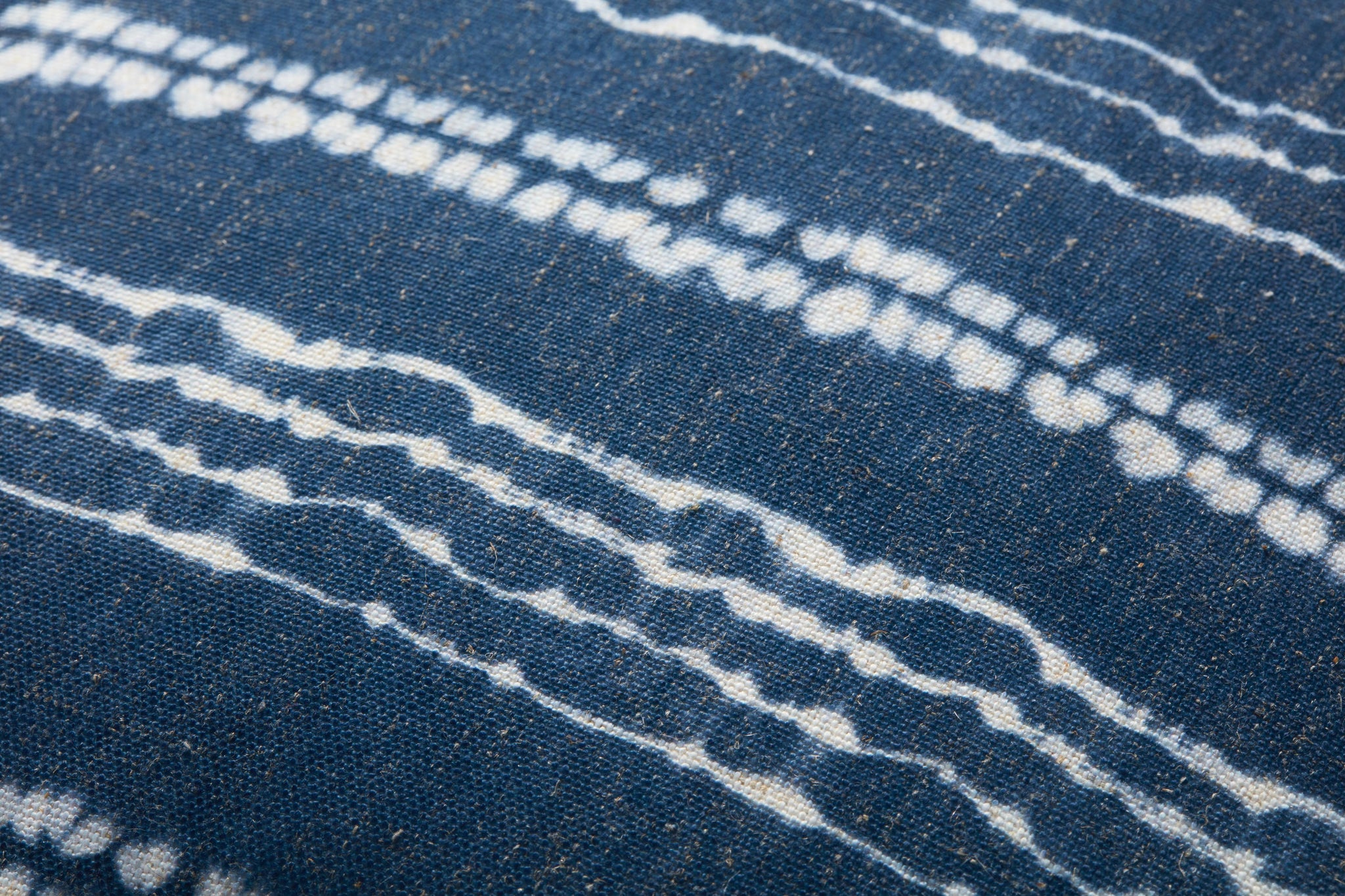 Indigo / Ivory Pouf shown from a different angle to reveal its pattern.