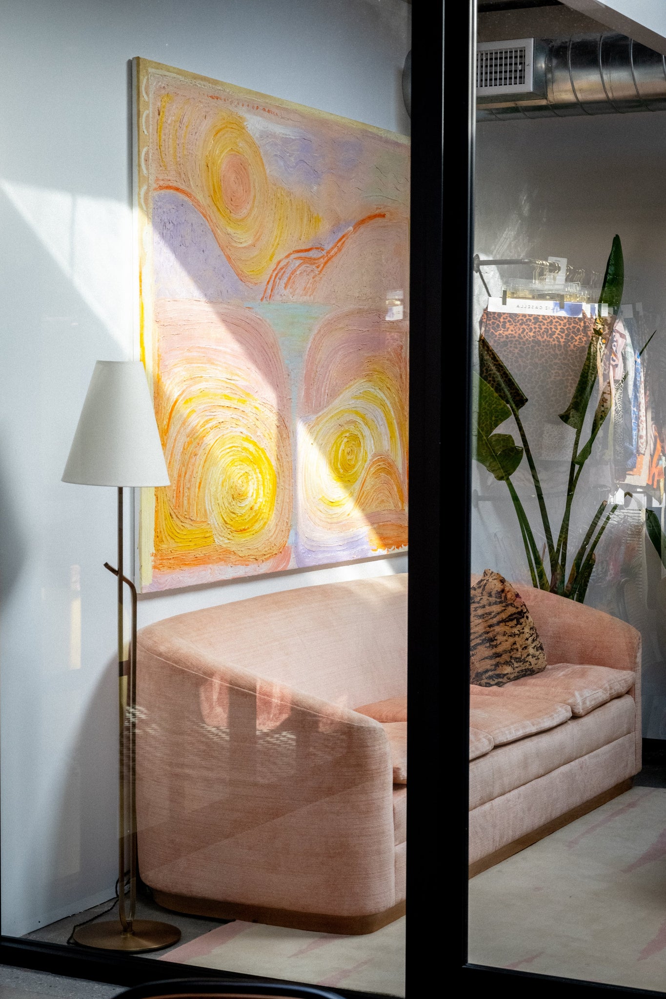 Pearce Floor Lamp styled in a bedroom for warm, layered light at Laurie Yapp Home.