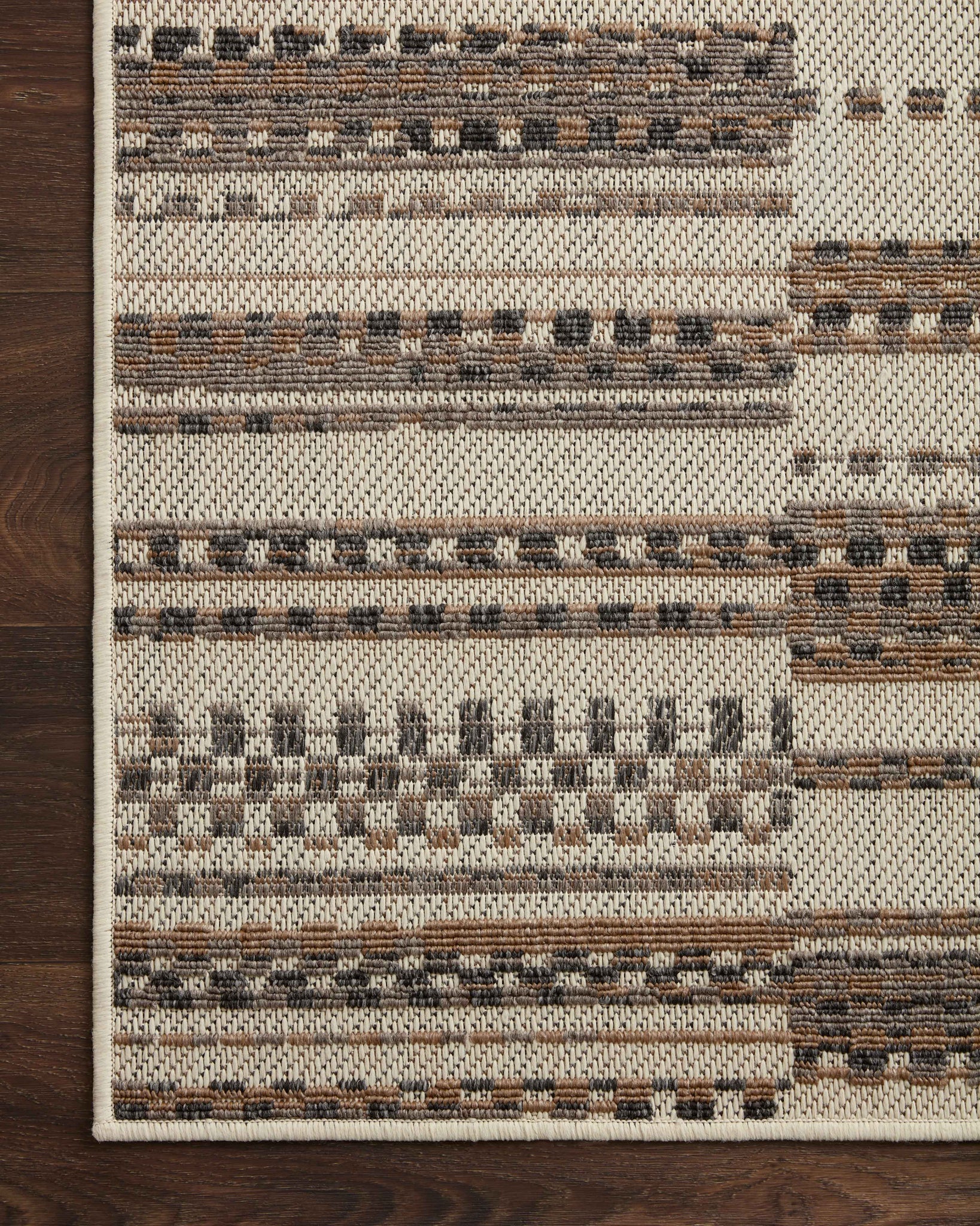 Rainier Ivory / Taupe shown from a different angle to reveal its pattern.