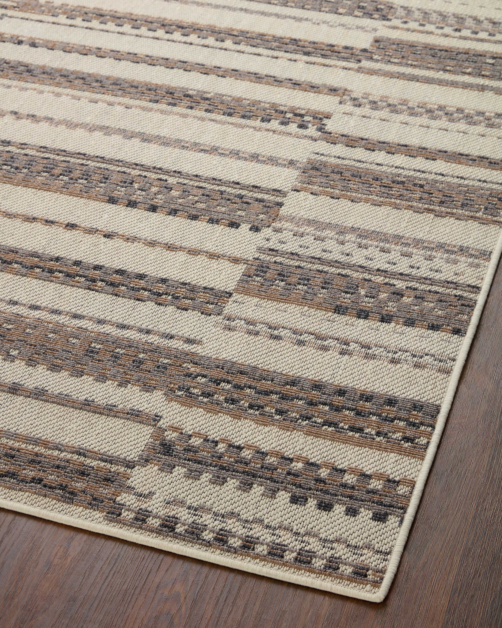 Rainier Ivory / Taupe shown from a different angle to reveal its pattern.