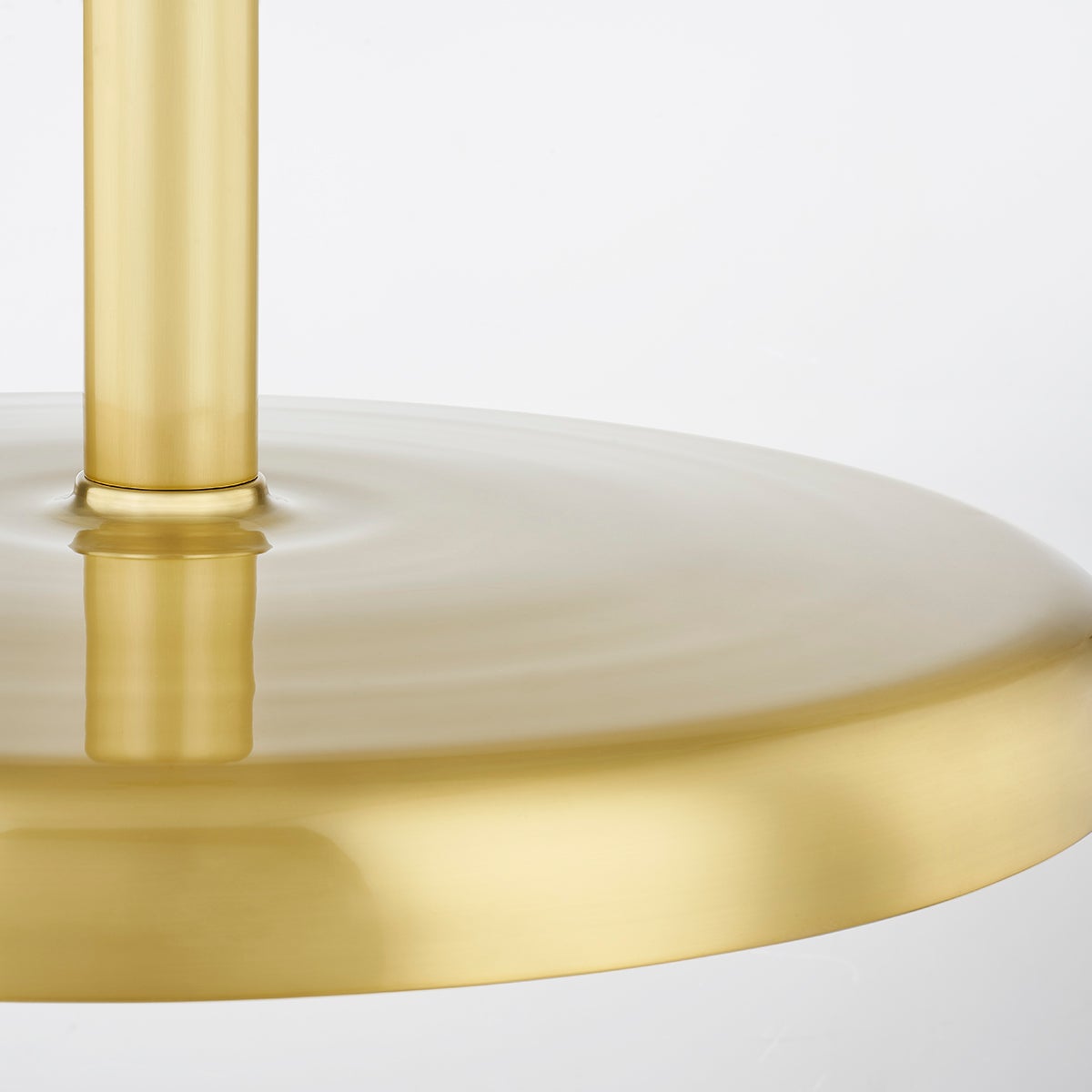 Reynolds Pendant 28" in aged brass shown from the front to reveal the shade shape and metal detail.
