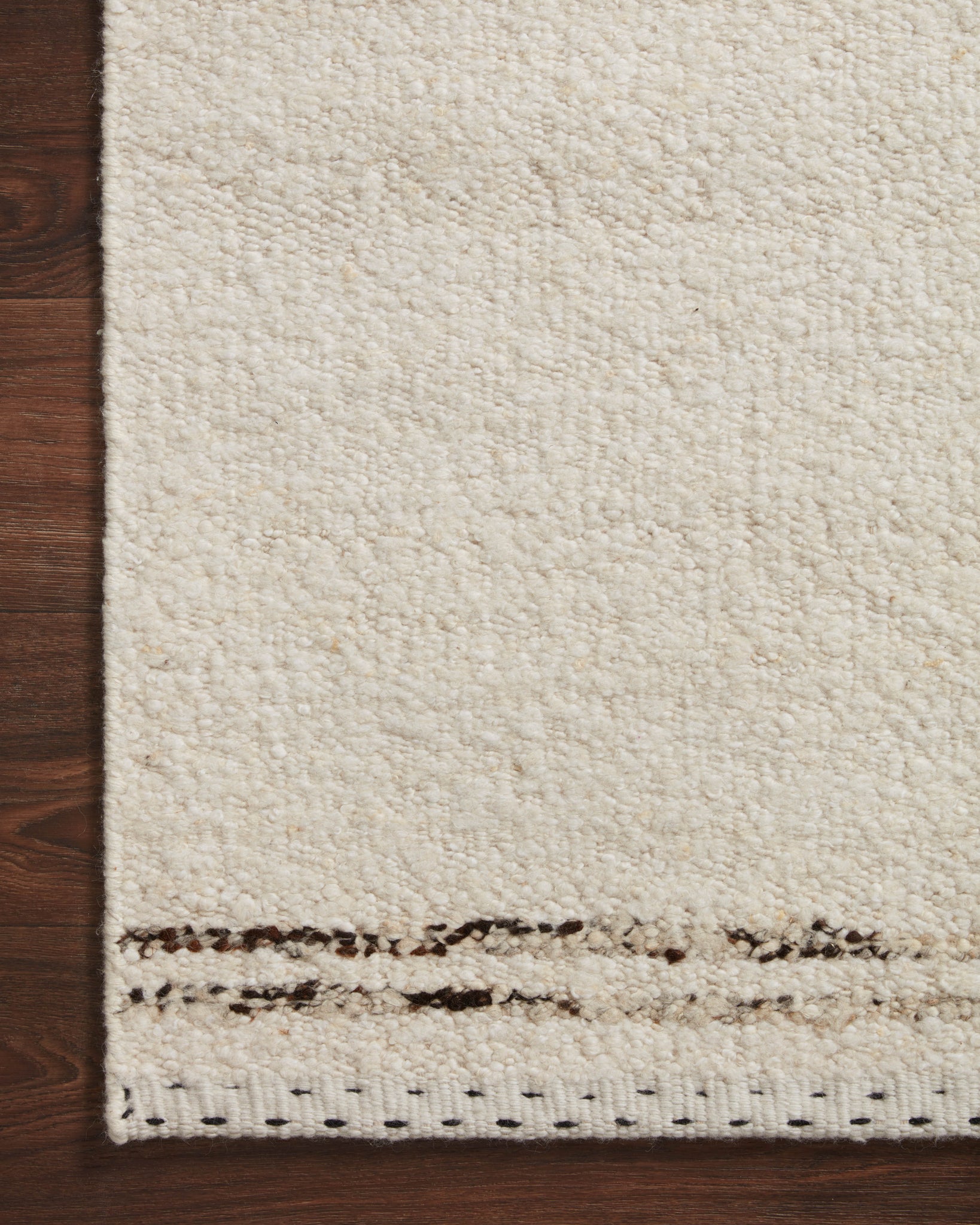 Side view of the Roman Ivory / Granite rug.