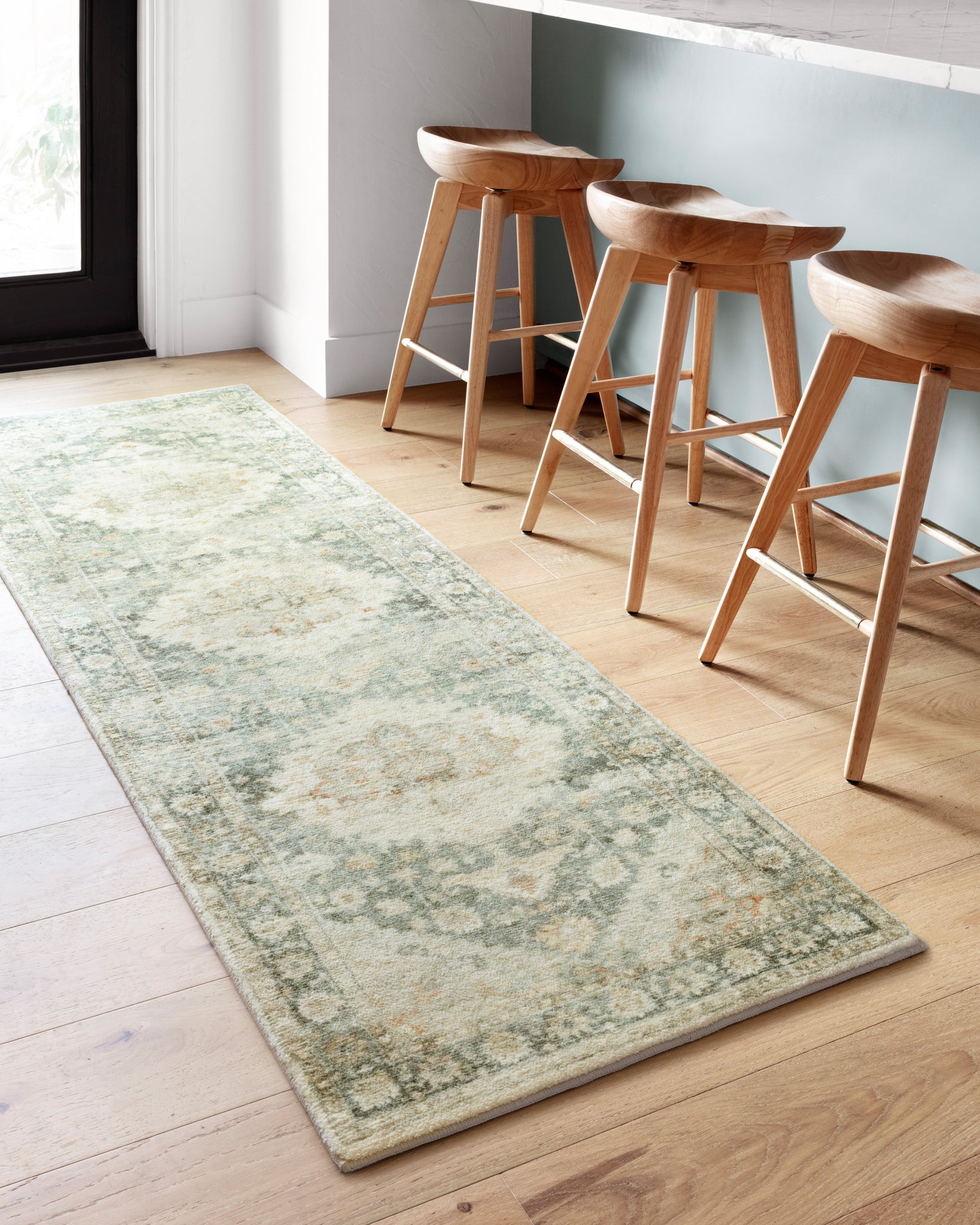 Rosette Teal / Ivory shown from a different angle to reveal its pattern.