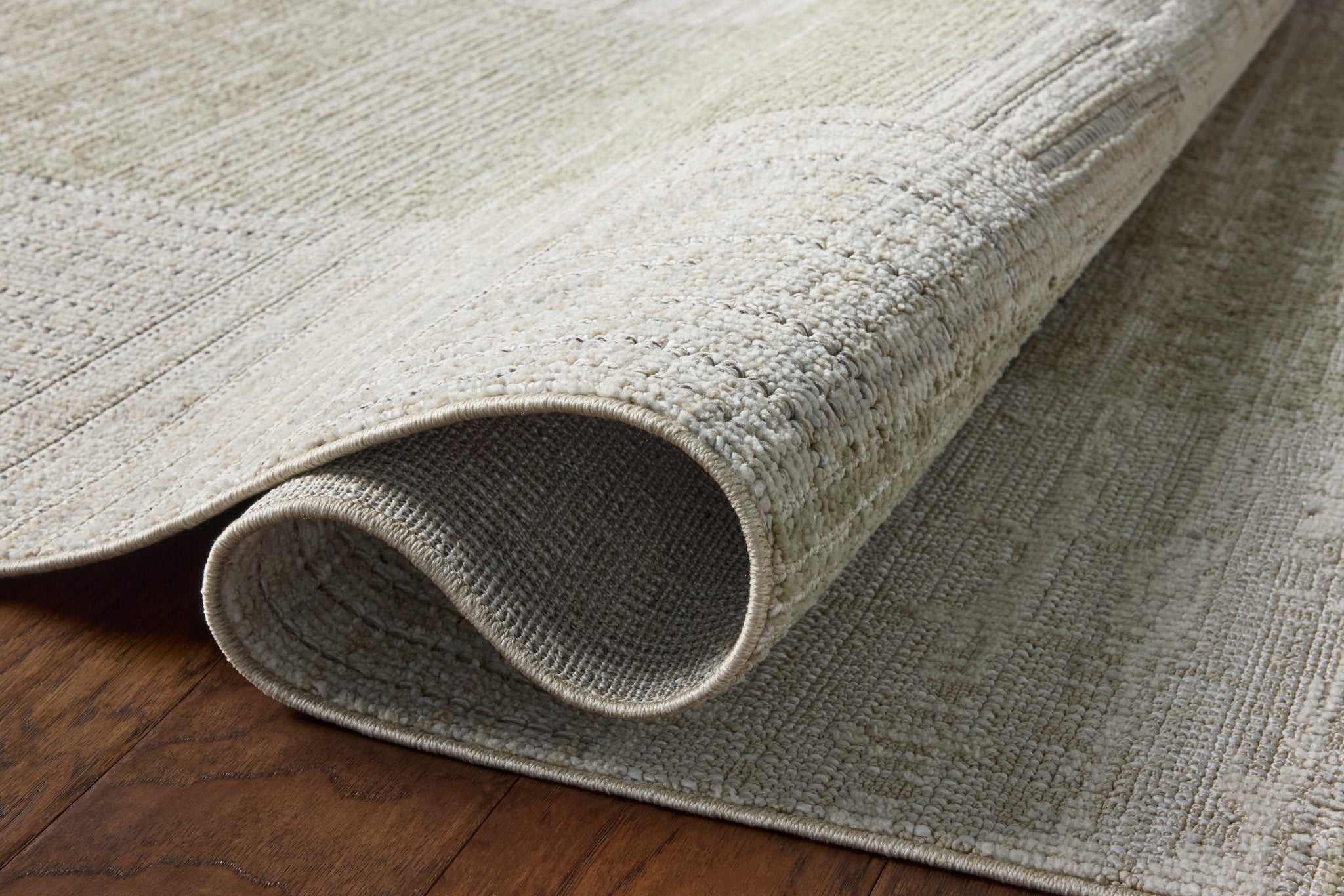Roxie Linen / Sage styled underfoot in a layered living room at Laurie Yapp Home.