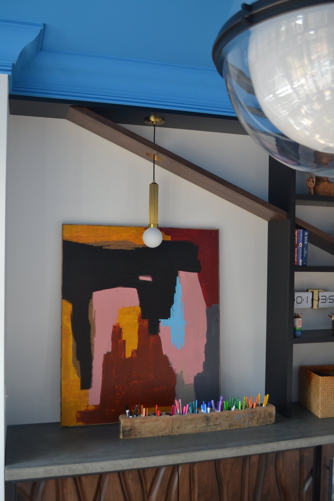 Reade Pendant in aged brass shown from the front to reveal the shade shape and metal detail.