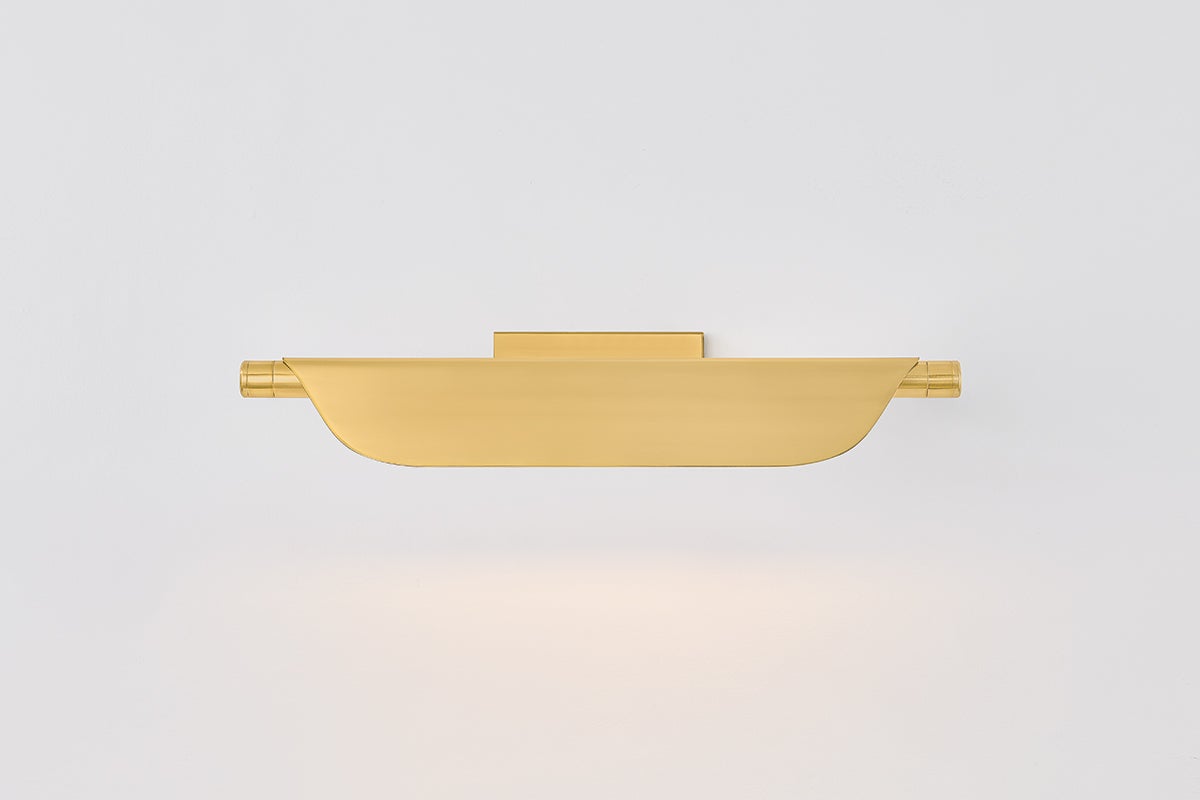 Tinwald Picture Light 19.25" in aged brass shown from a second angle to highlight the arm curve and shade proportion.