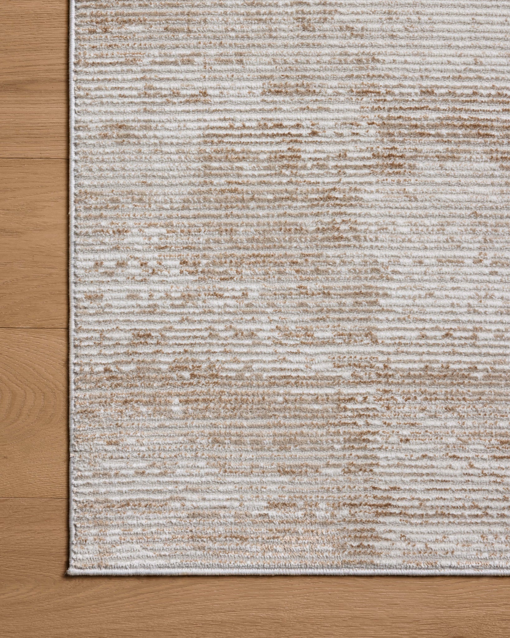 Townes Sand / Beige shown from a different angle to reveal its pattern.