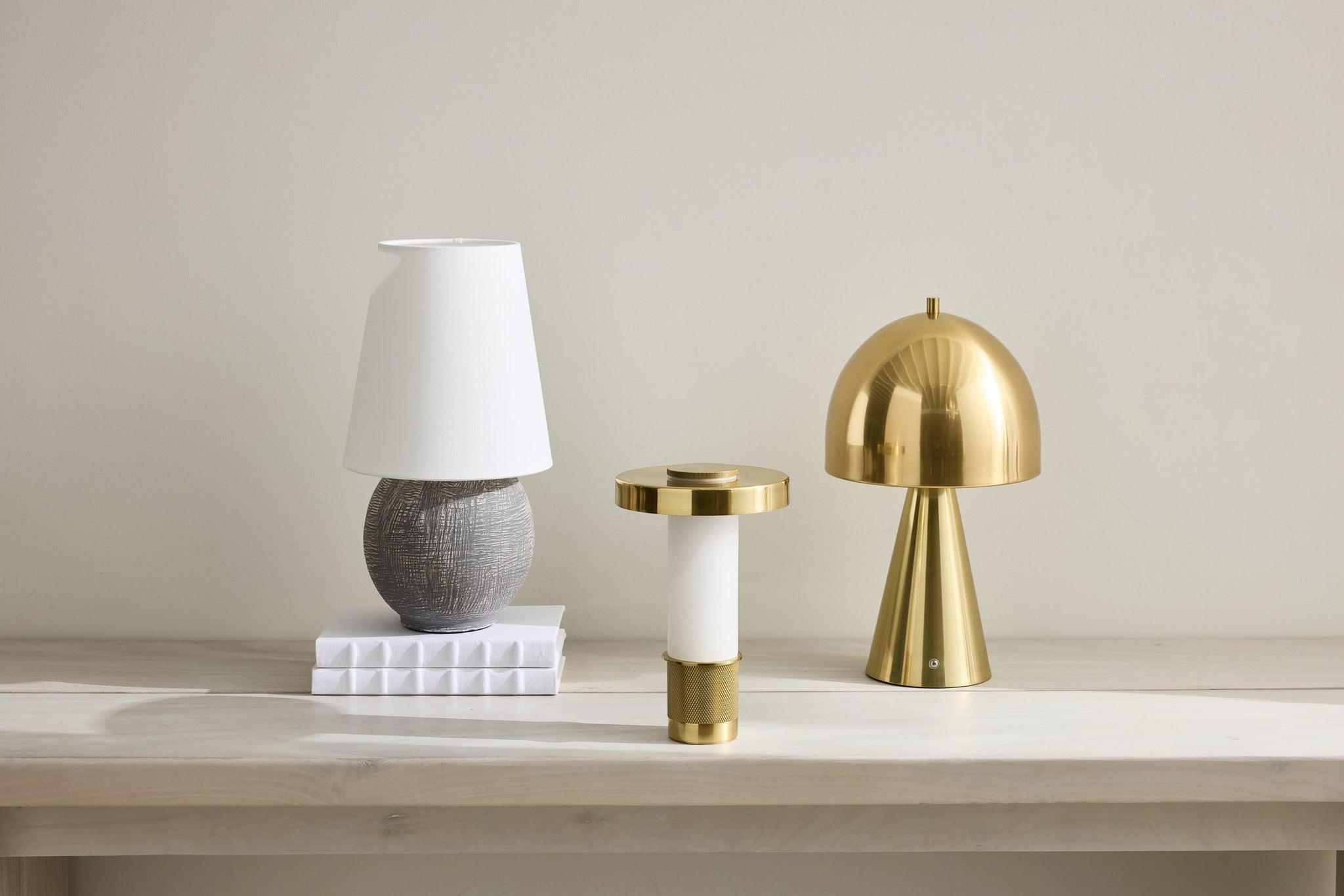Hopkinton Rechargeable Table Lamp in aged brass styled in a curated interior for warm, layered light at Laurie Yapp Home.