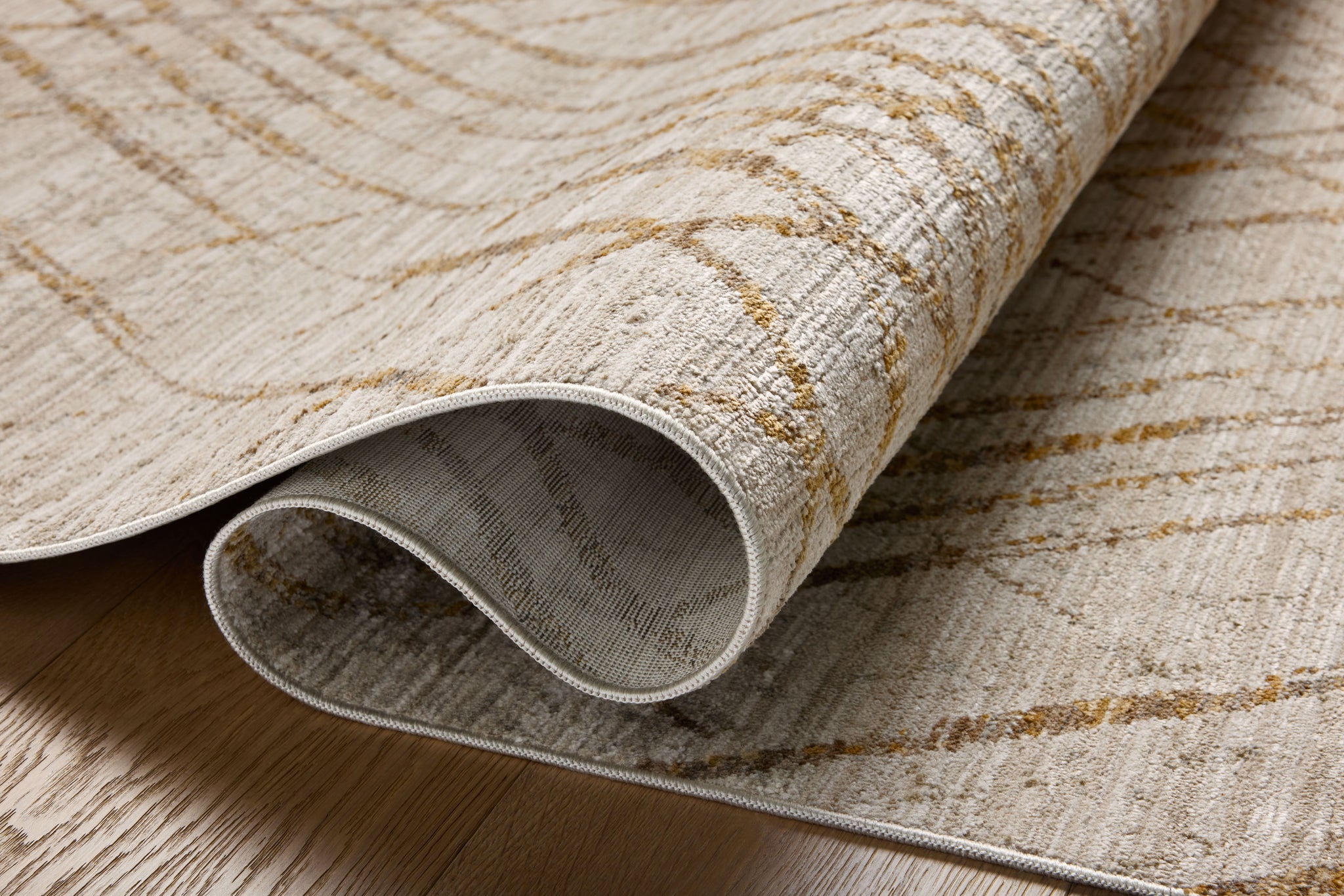 Wade Beige / Gold shown from a different angle to reveal its pattern.