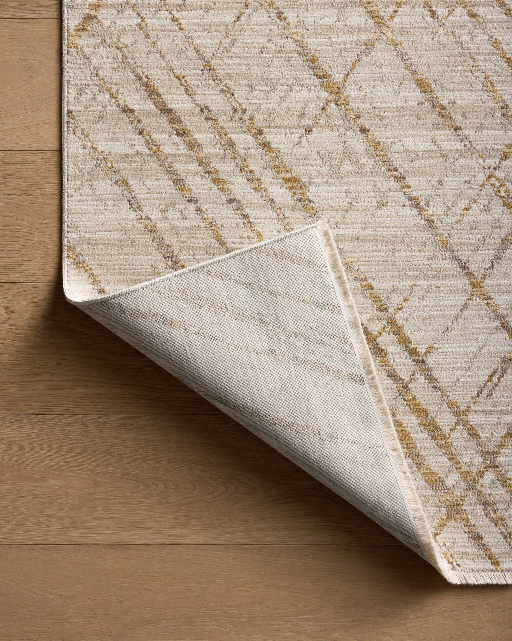 Wade Beige / Gold shown from a different angle to reveal its pattern.