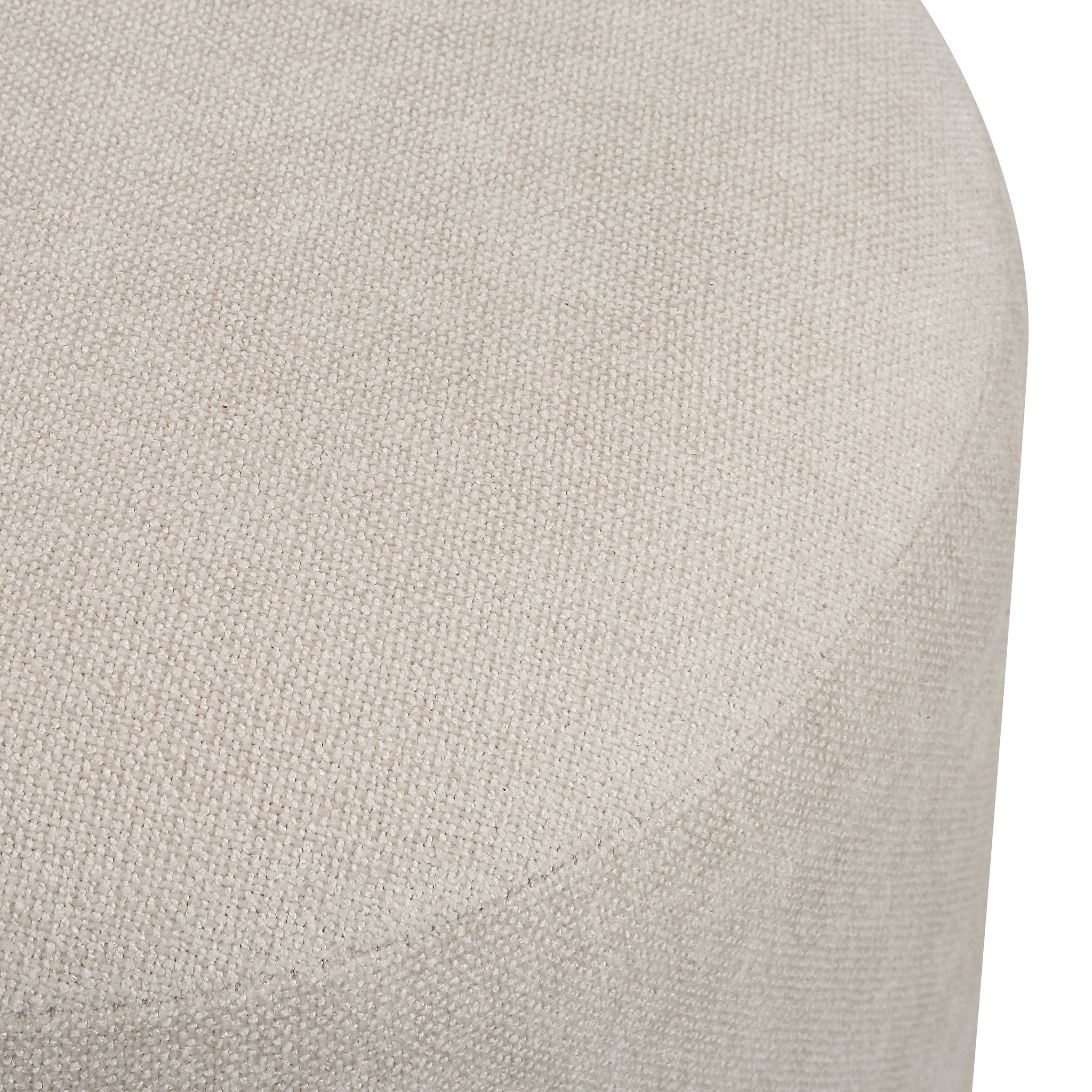 Top view of Persea stool highlighting the soft beige fabric and rounded shape.