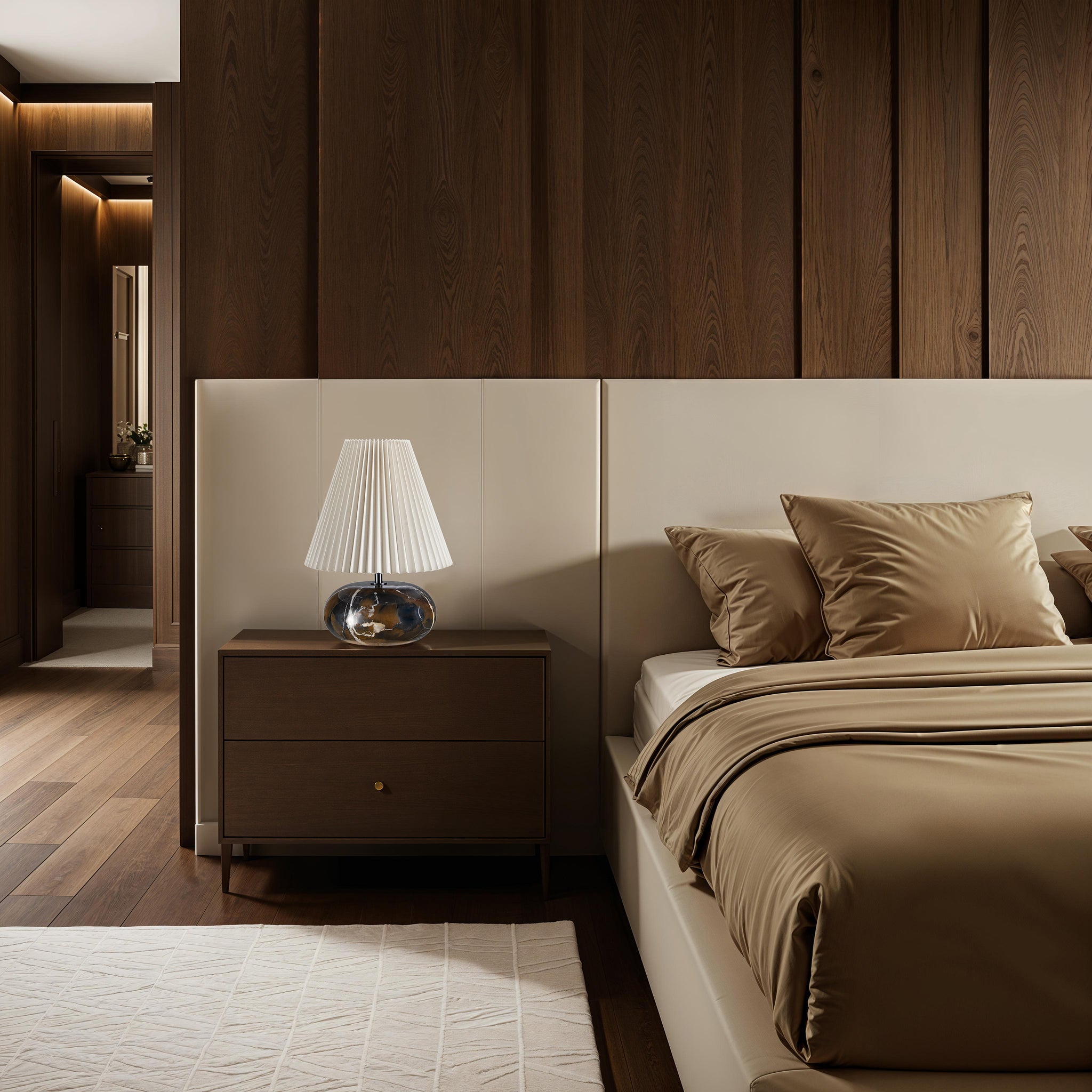 Noto Brown table lamp on a modern nightstand in a stylish bedroom with dark wood accents.