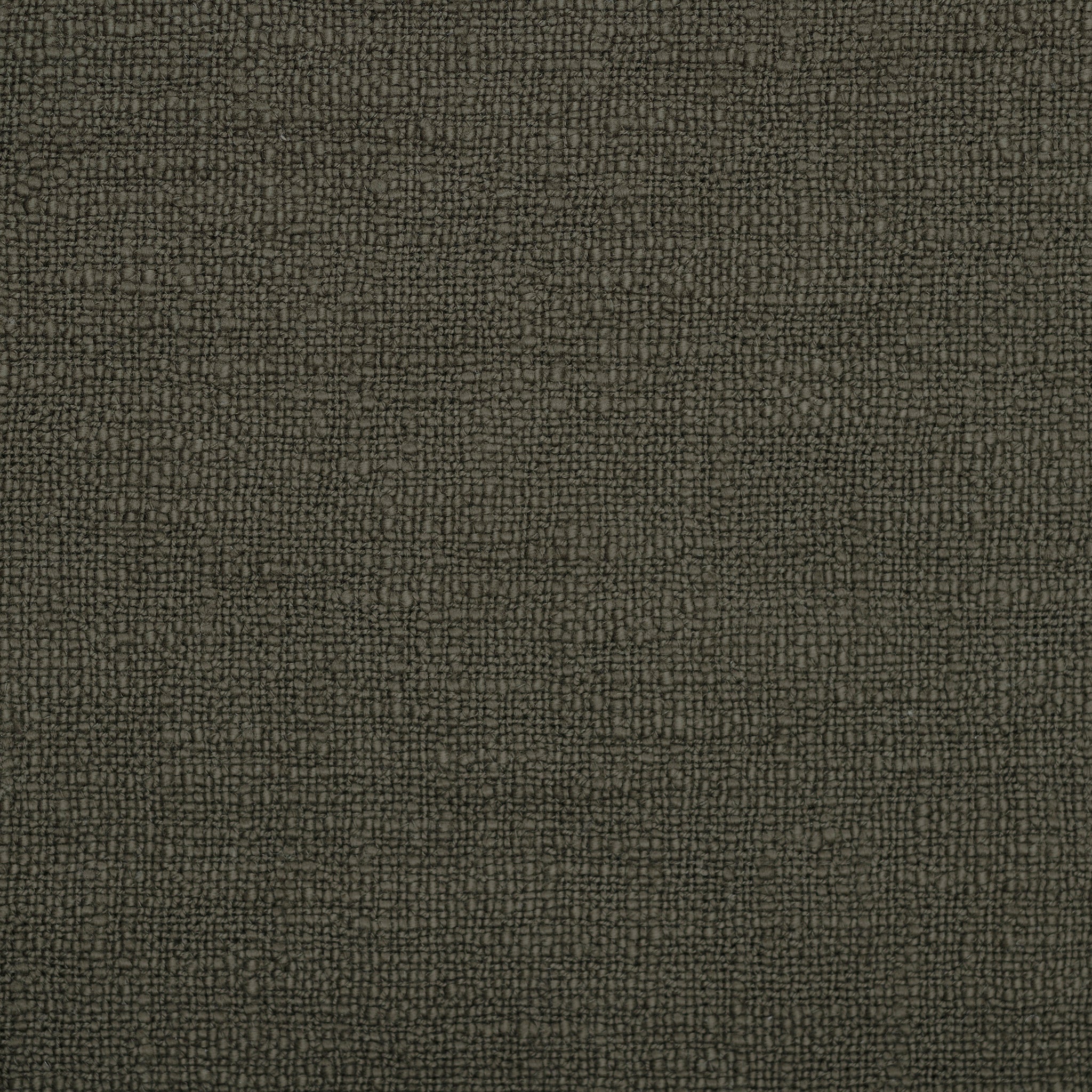 Close-up of Chalamet Throw Blanket texture in dark green, highlighting woven pattern.