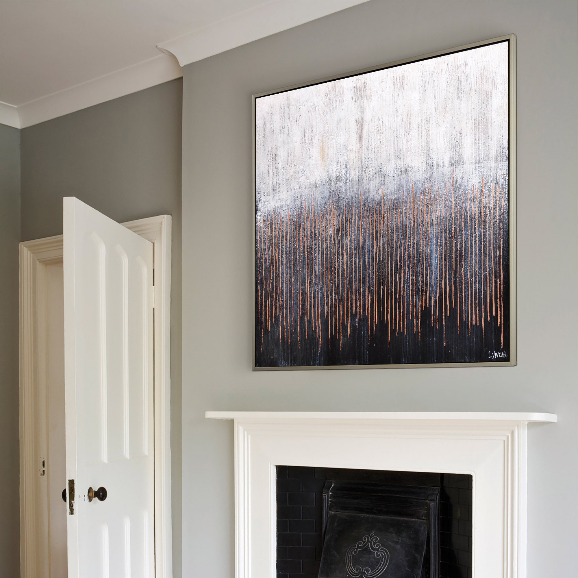 Flynn canvas art displayed on a wall above a fireplace in a modern living room setting.
