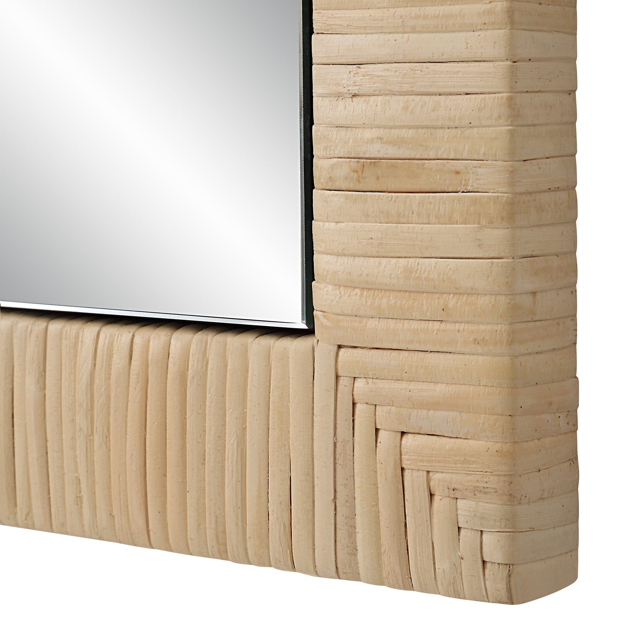 Close-up of Tally Wall Mirror's textured woven frame and reflective surface