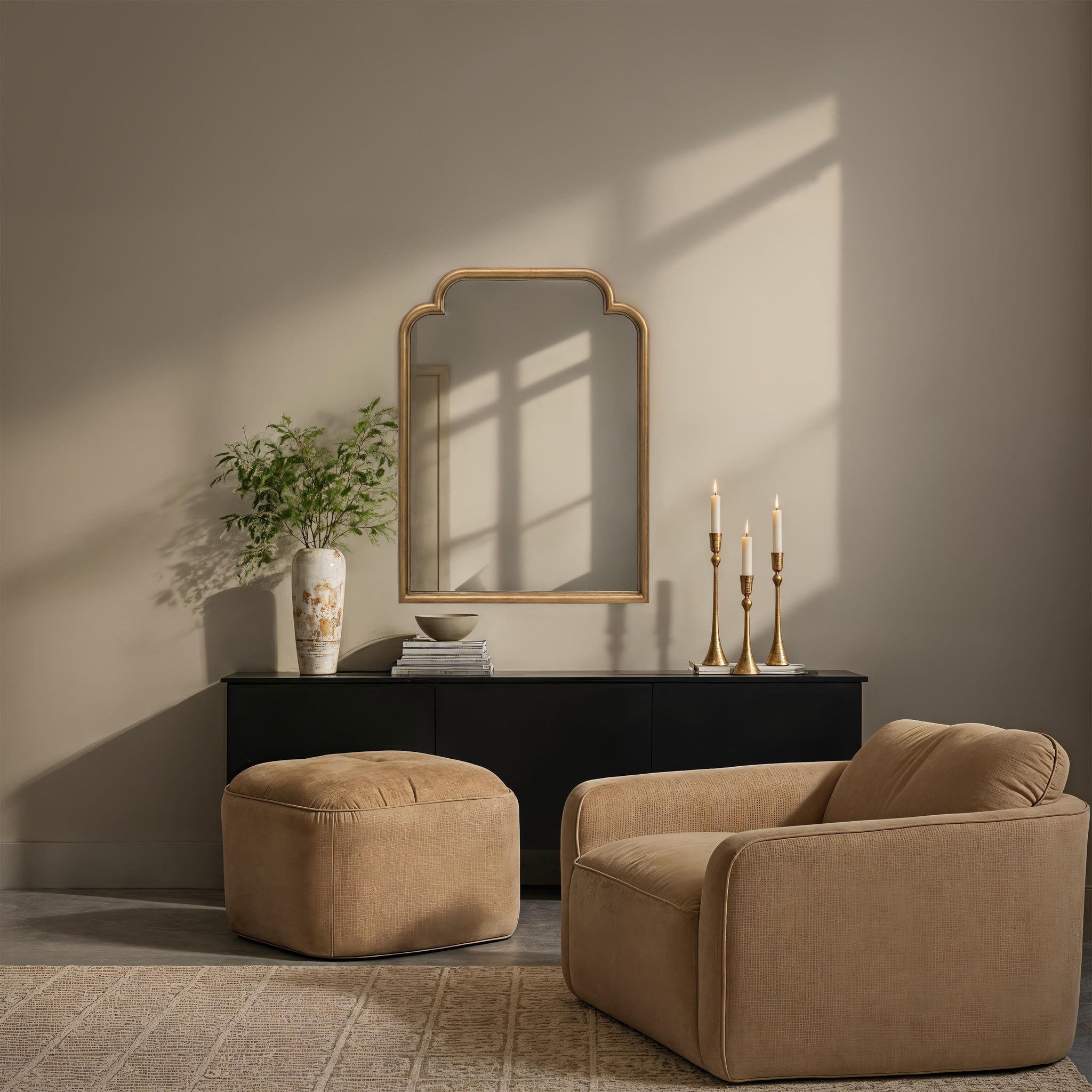 Emilien mirror displayed in a living room setting with beige armchair and decor.