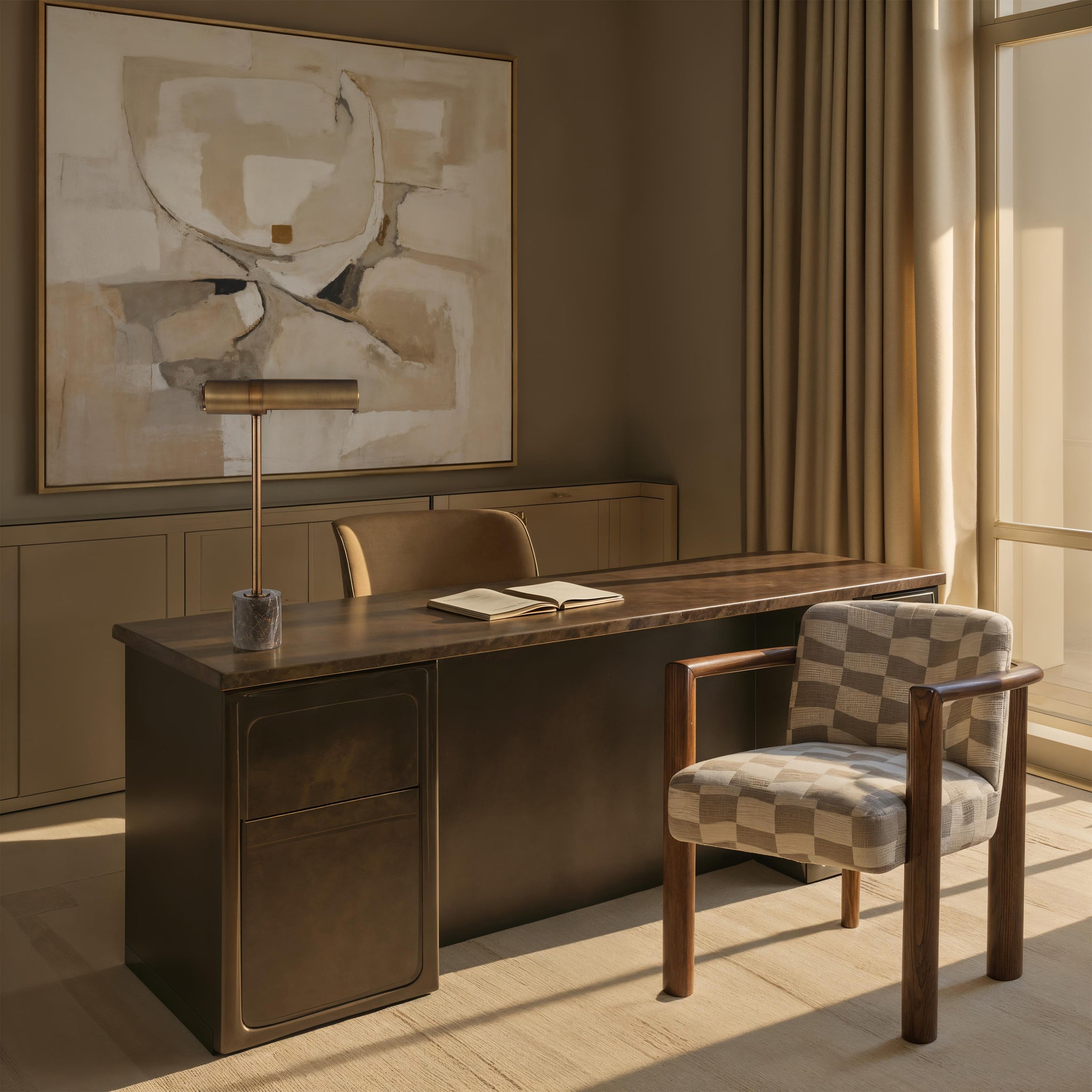 Gusle Table Lamp placed on a modern desk in a stylish office setting with artwork in the background.