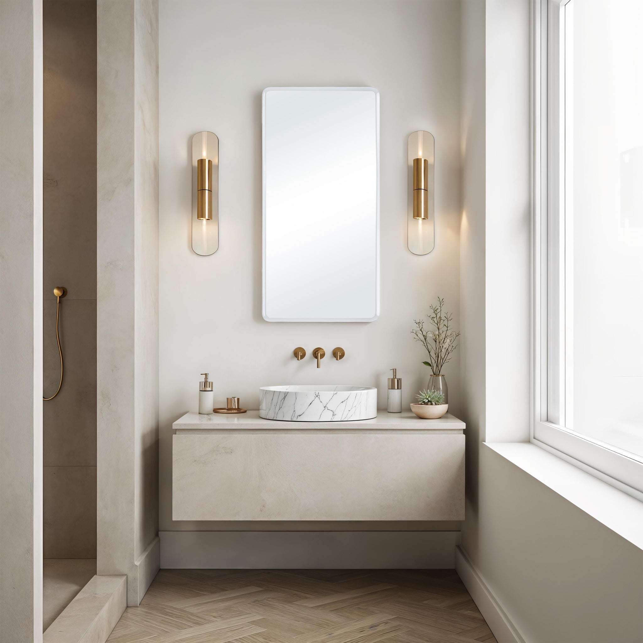 Danske mirror displayed in a modern bathroom setting with gold fixtures.