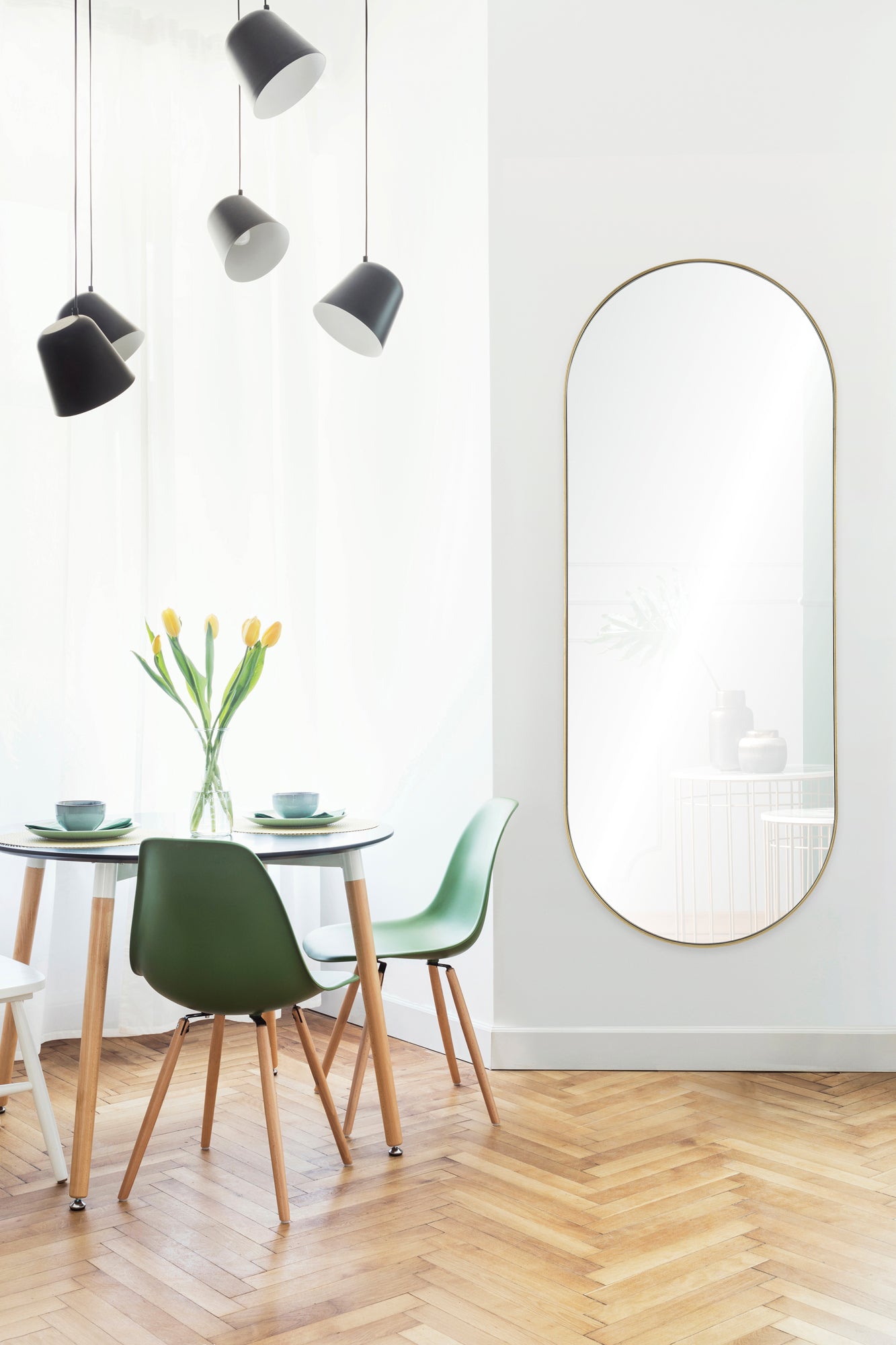 Marius Full Length Mirror displayed in a bright dining area with green chairs