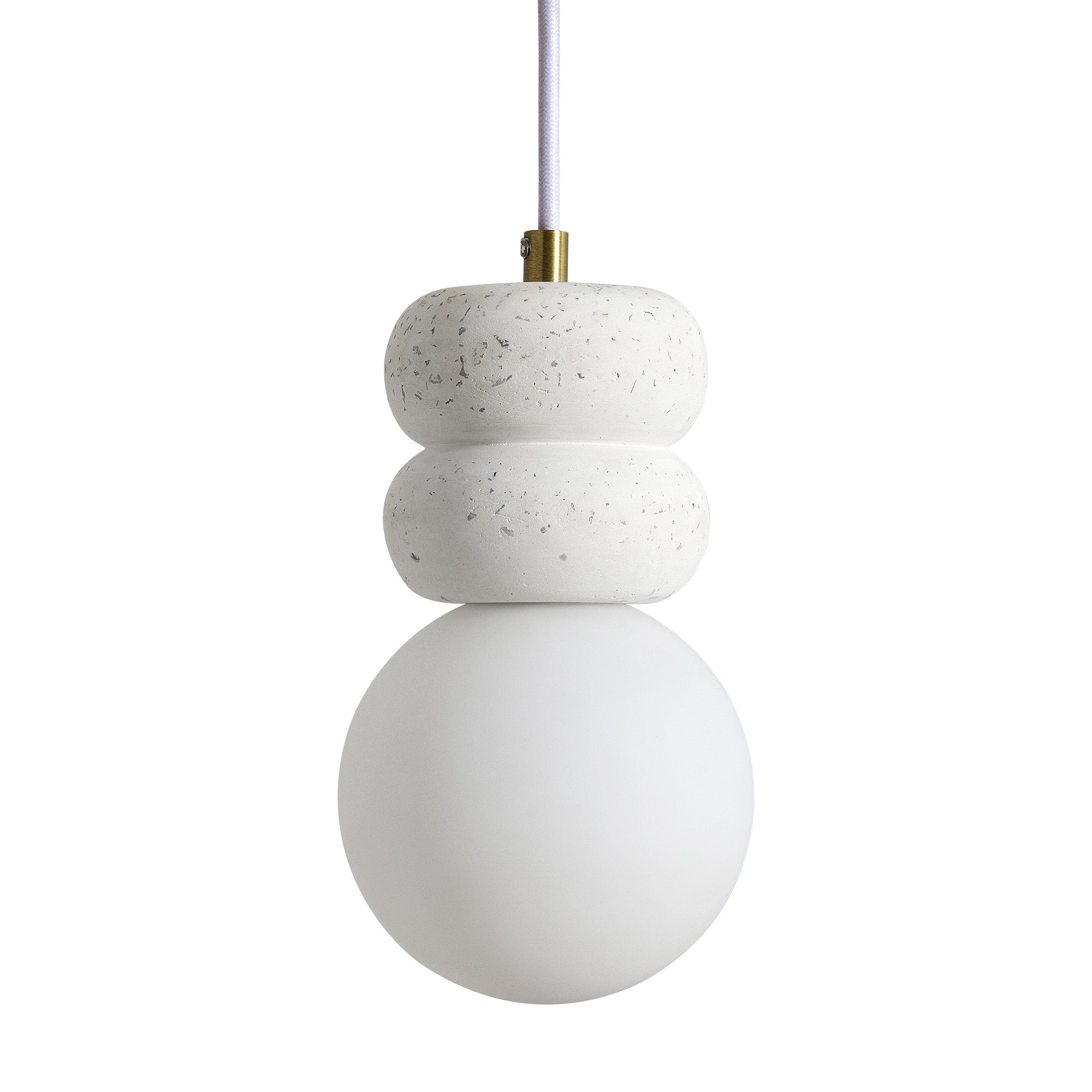 Candra Ceiling Fixture with a white ceramic base and globe, highlighting its minimalist design and brass attachment.