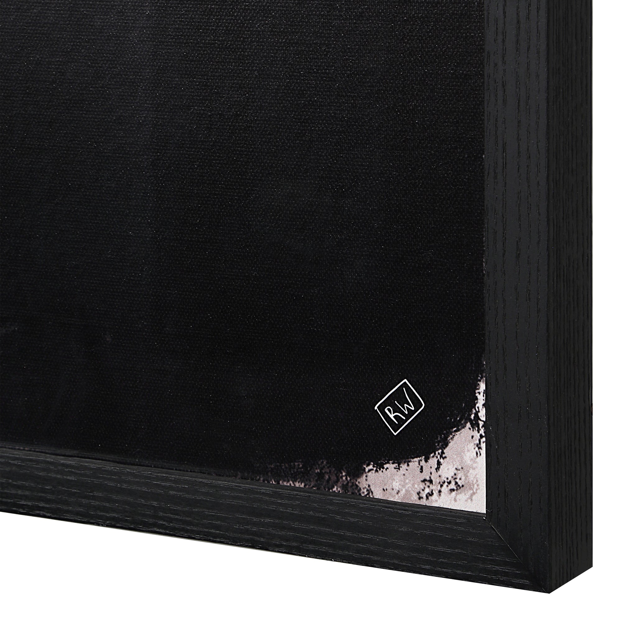 Close-up of Caramelo wall art showing black canvas with abstract shapes and logo detail.
