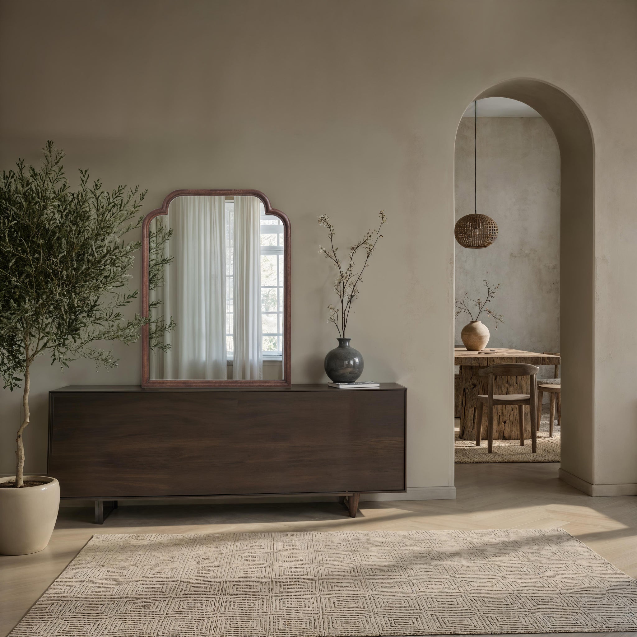 Octavian mirror displayed in a stylish interior with a wooden sideboard and decor.