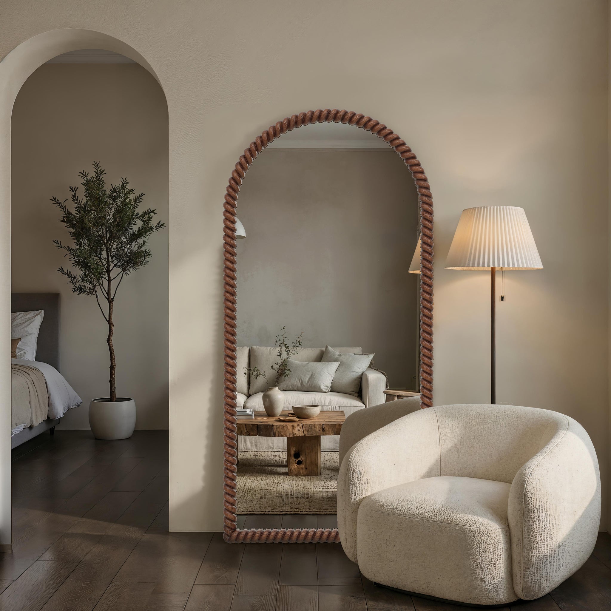 Madiwell mirror in a stylish interior setting, reflecting a cozy living room scene.