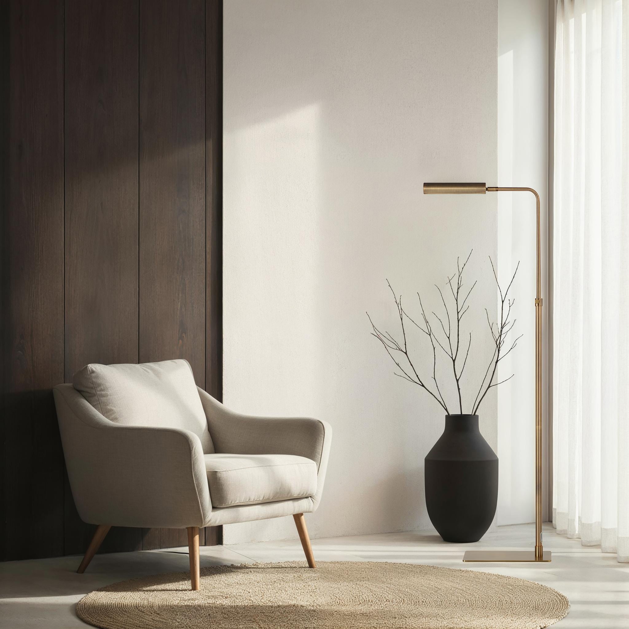 Kane floor lamp by Renwil in a stylish living room setting with a chair and vase