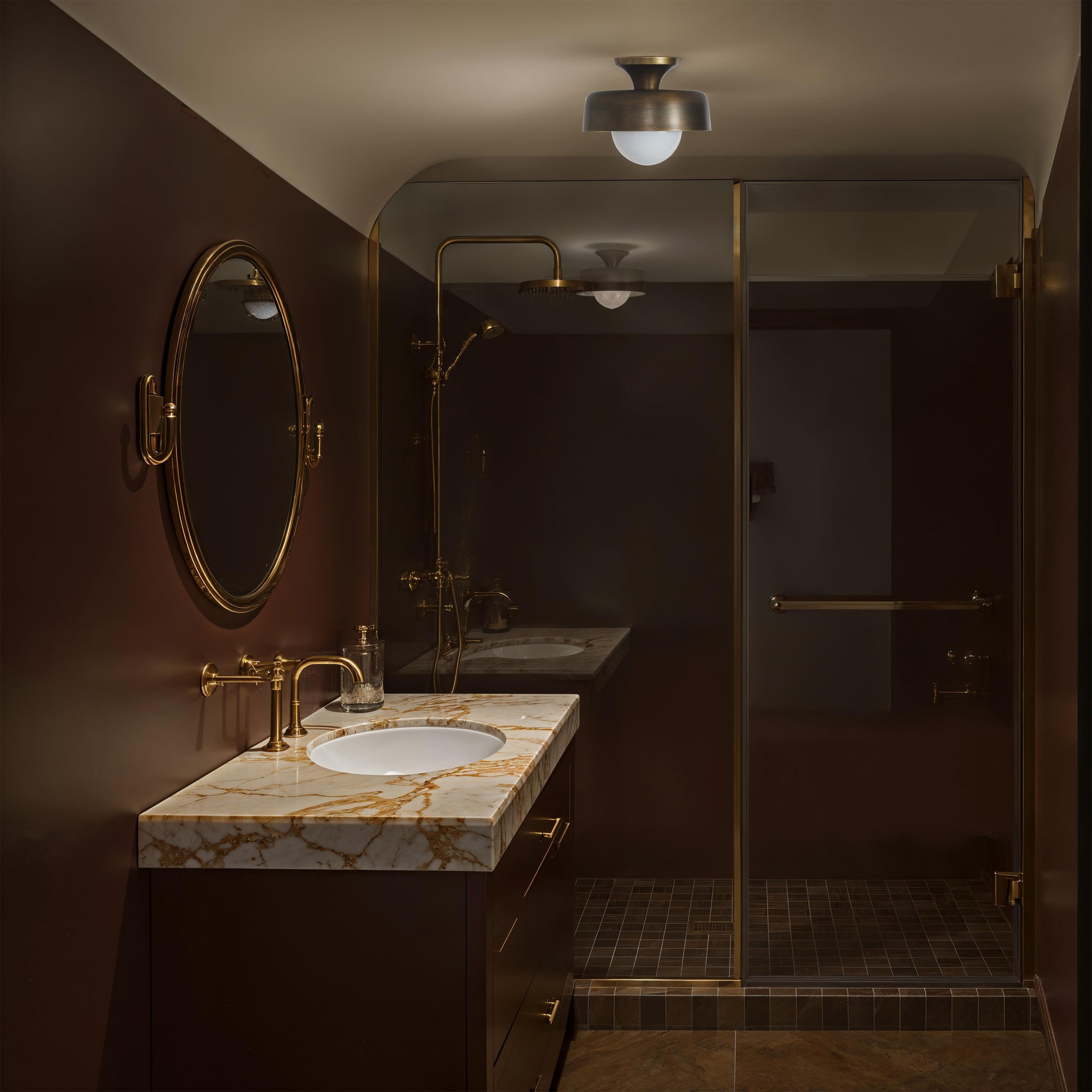 Flare Flush Mount by Renwil installed in a modern bathroom with marble countertop.