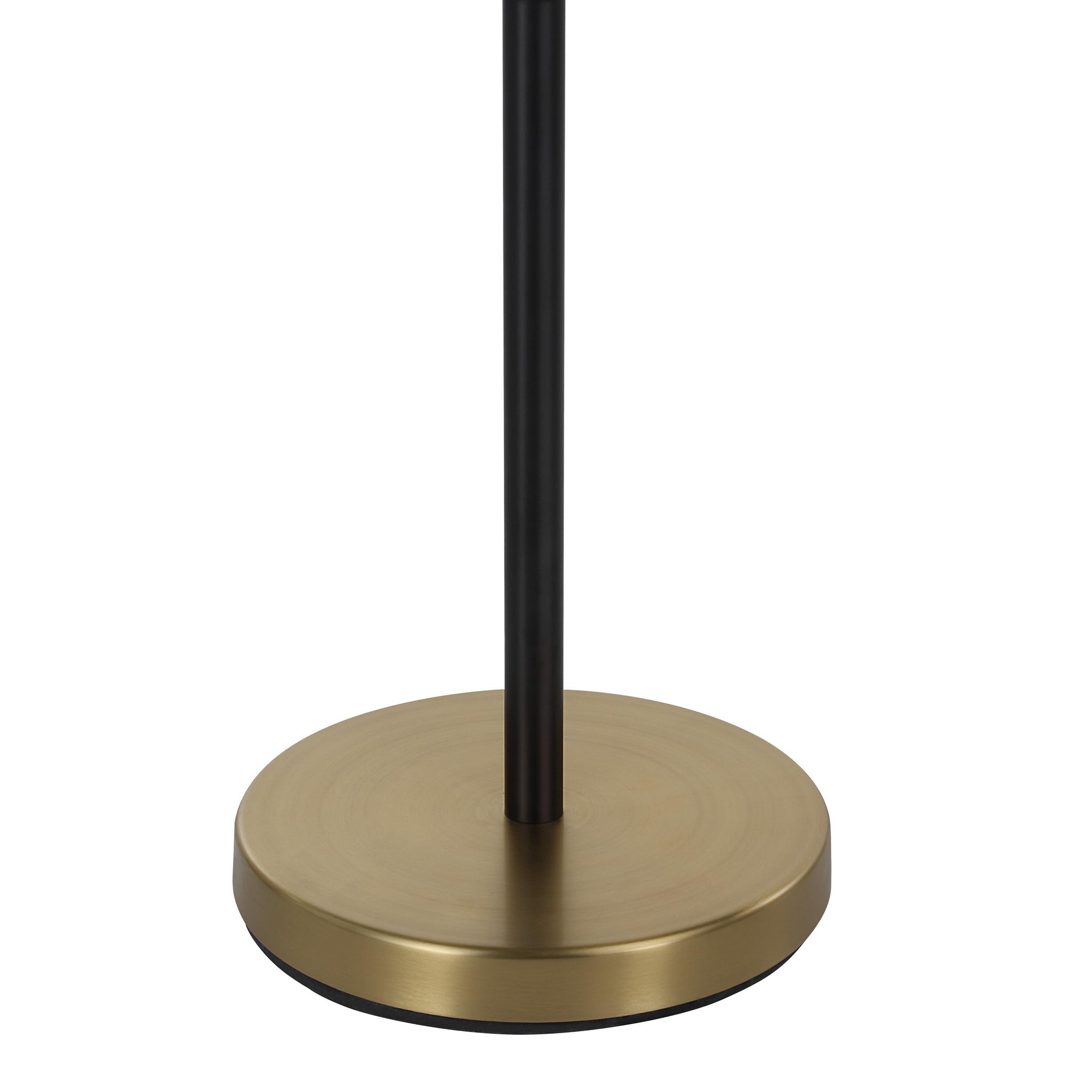 Base of the Mosaic floor lamp showing a round gold base and black pole.